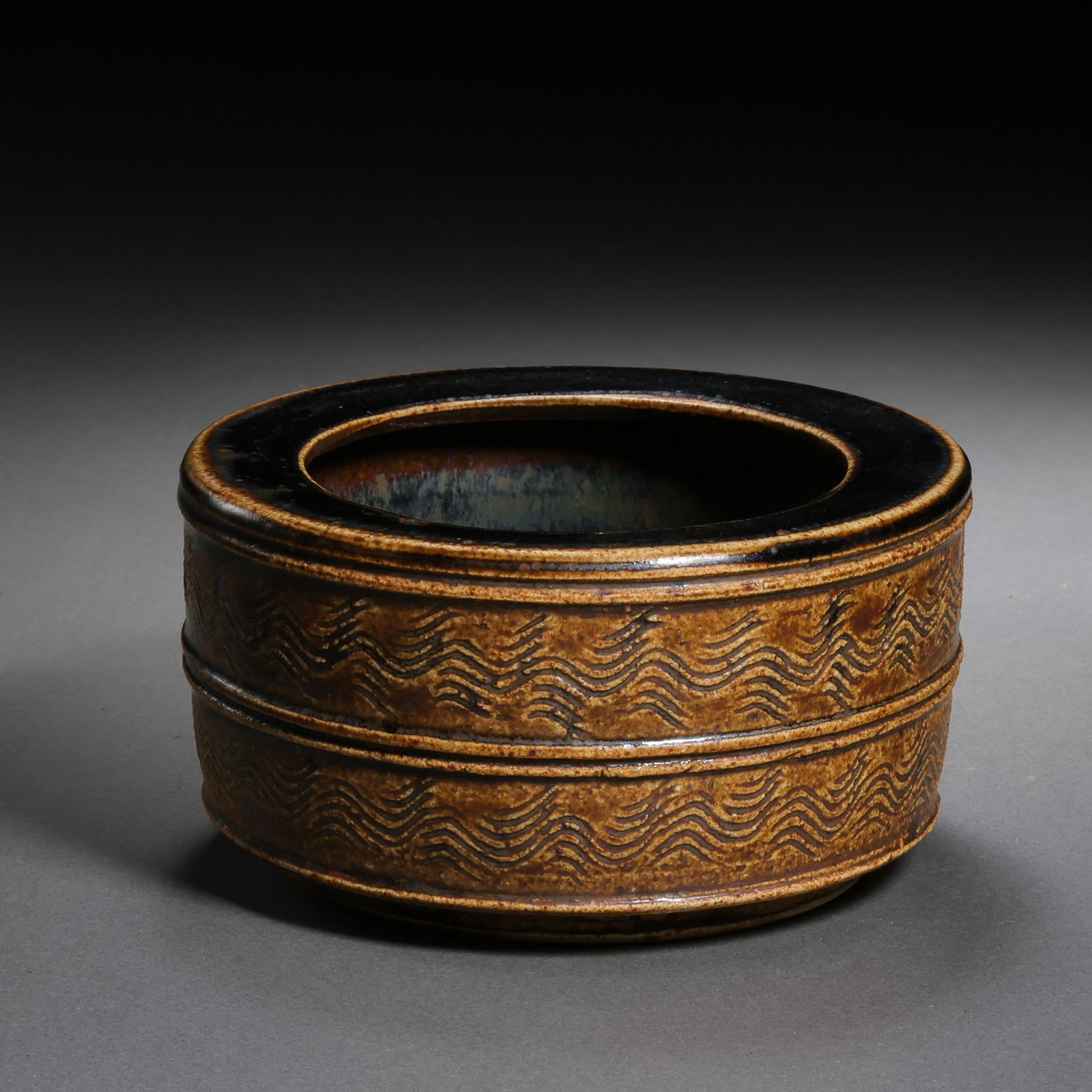 black-glazed water dropper with water ripple design from the Cizhou kiln of the Northern Song: H. 5.5 cm. W. 10.5 cm.