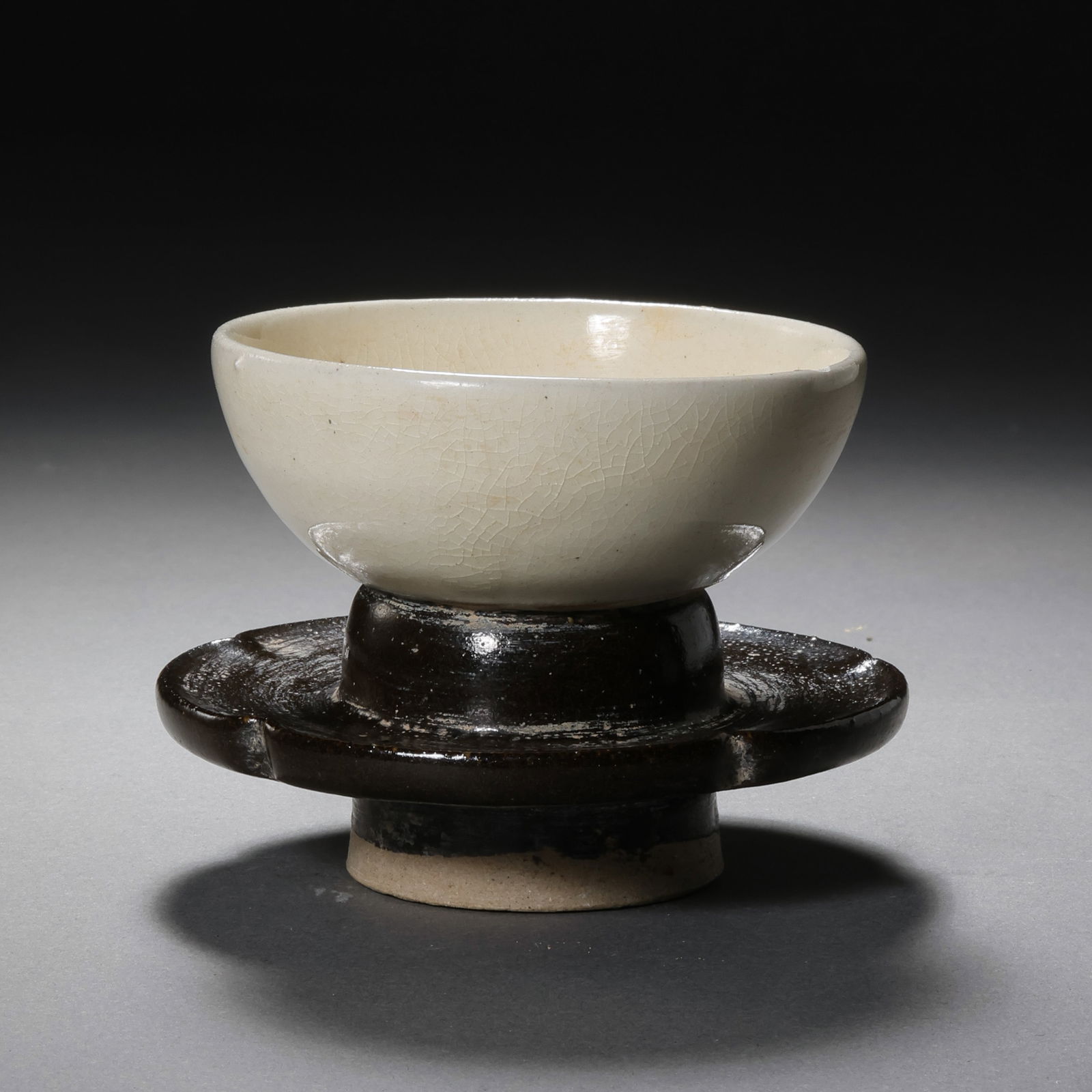 Black and white glazed cup stand from Cizhou ware, Northern Song Dynasty, China: H. 6.2 cm. W. 8 cm.