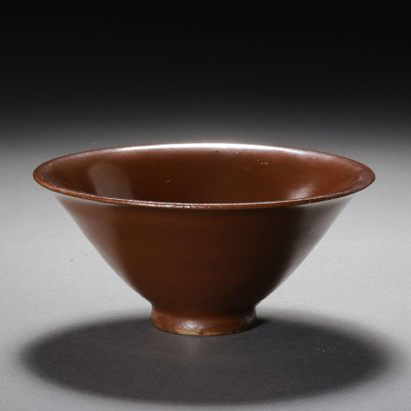 Red-glazed conical cup from Yaozhou kiln, Northern Song Dynasty, China: H. 5.5 cm. Diam. 12.5 cm.