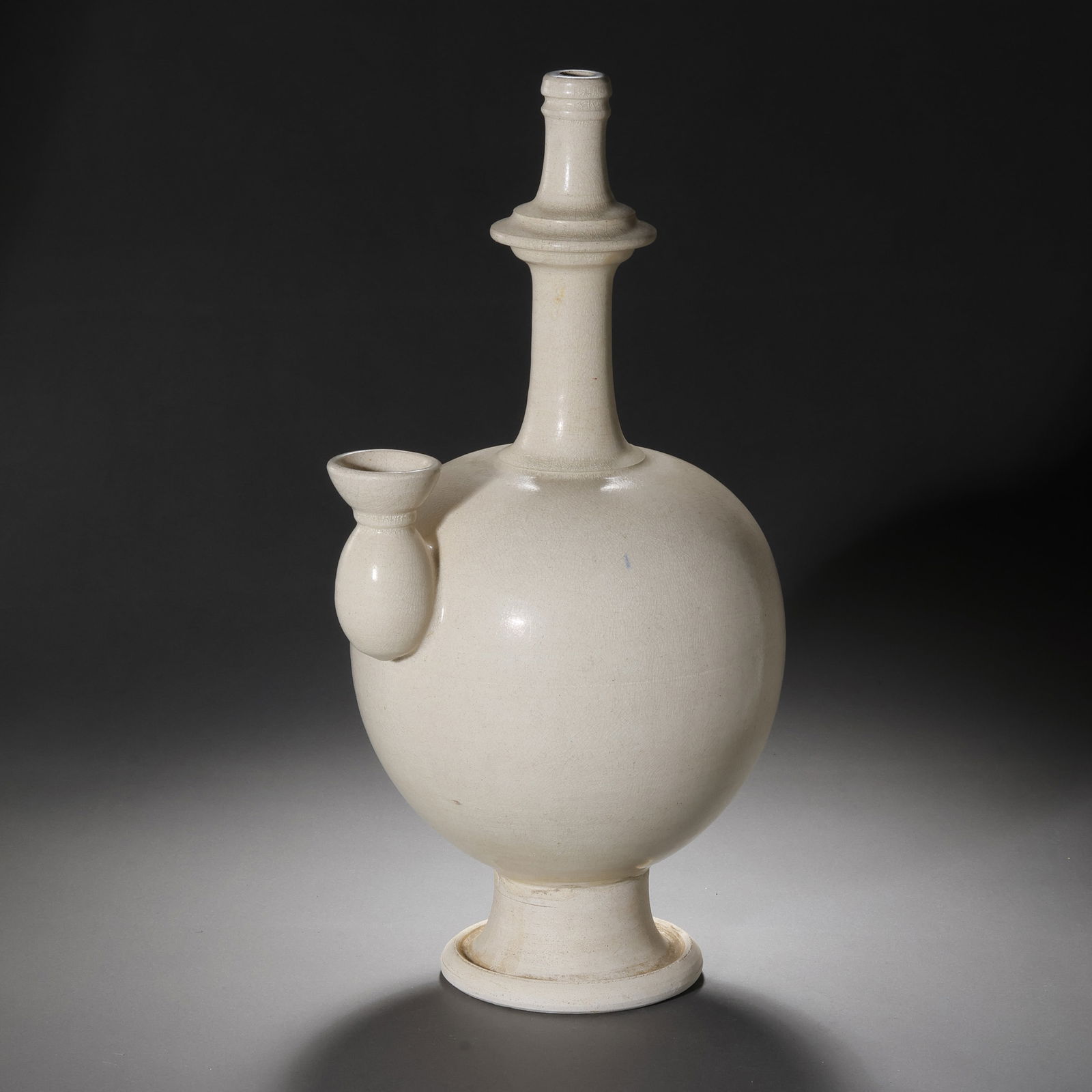 Tang Dynasty, ChinaGongxian Kiln White Porcelain Bottle: H. 32 cm.