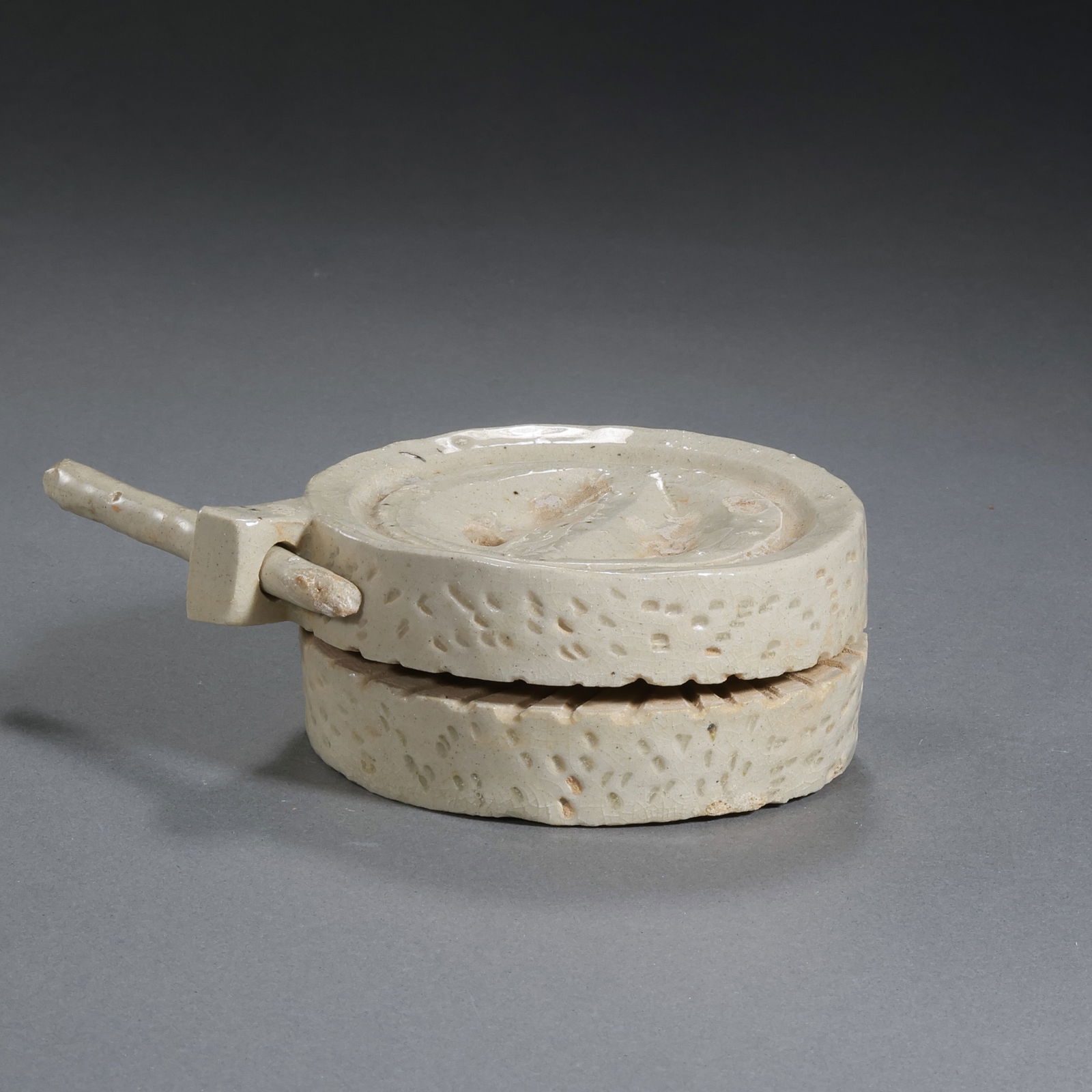 Tang Dynasty, ChinaGongxian Kiln White Porcelain Ink Stand: H. 3.1 cm. W. 8 cm.