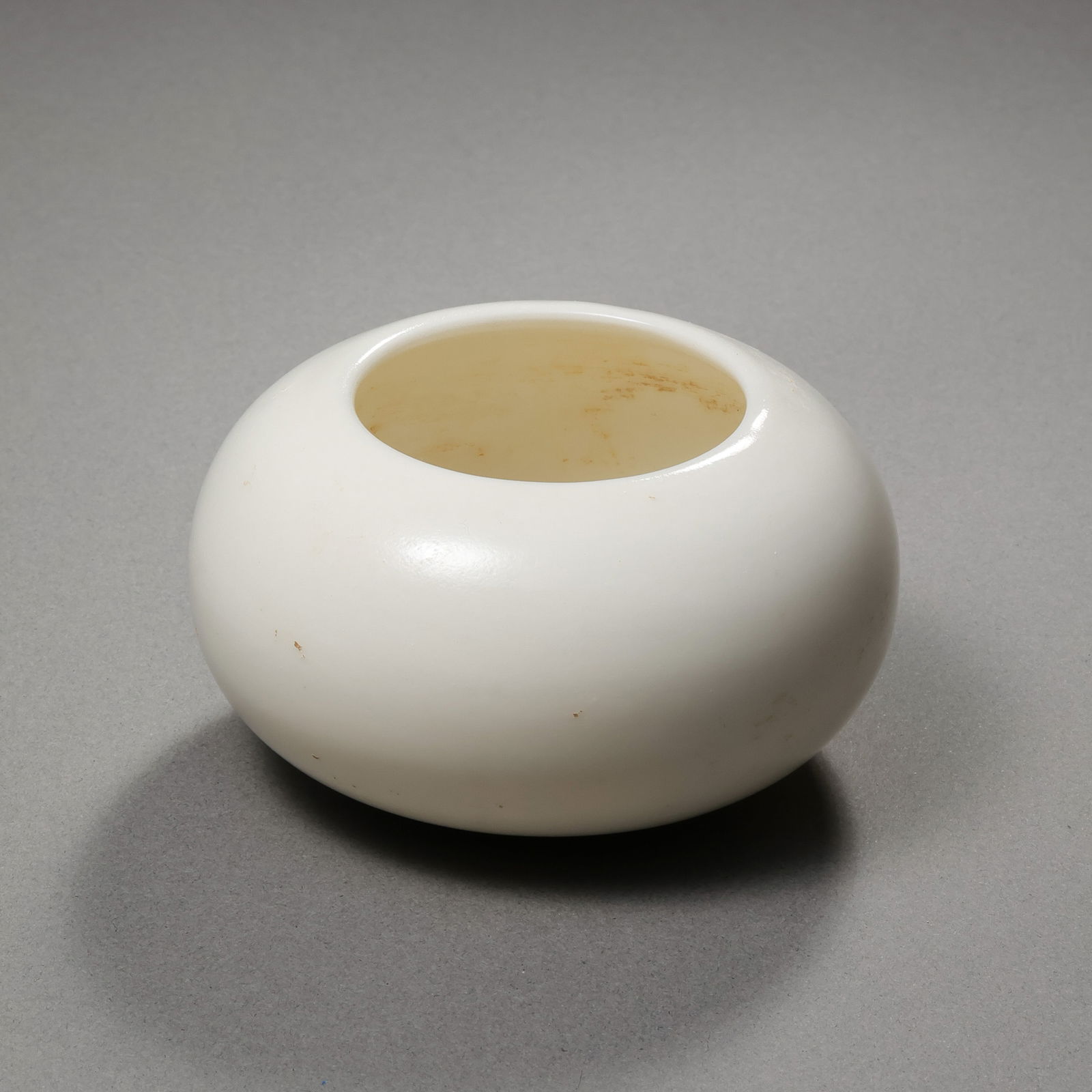 Chinese Sui Dynasty white porcelain water dropper: H. 4.3 cm. W. 7 cm.