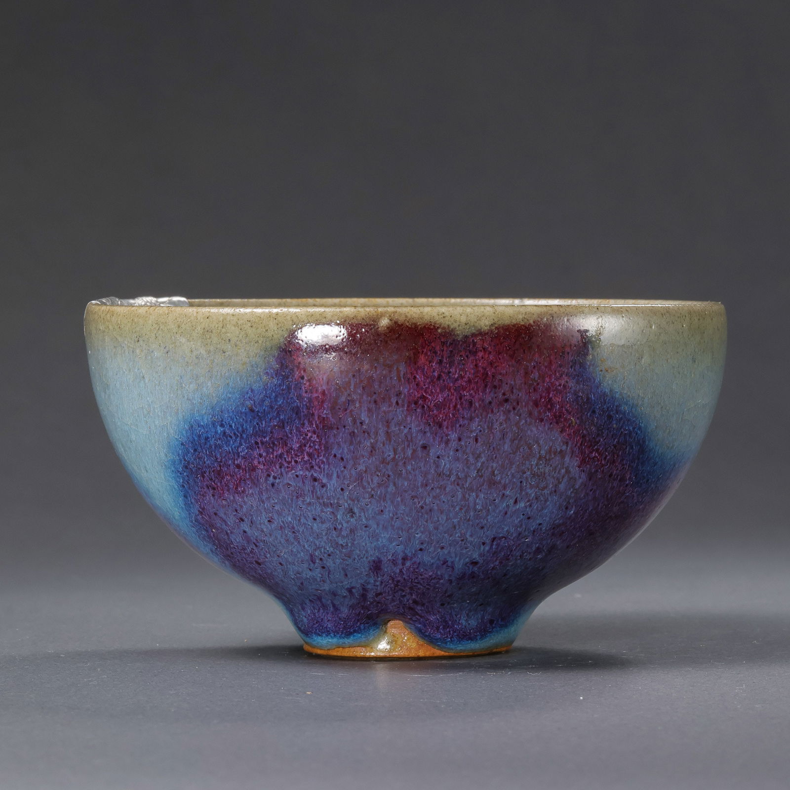 A small Jun ware cup from the Northern Song Dynasty in China, with sky-blue glaze and red and silver: H. 5.3 cm. Diam. 9.5 cm.