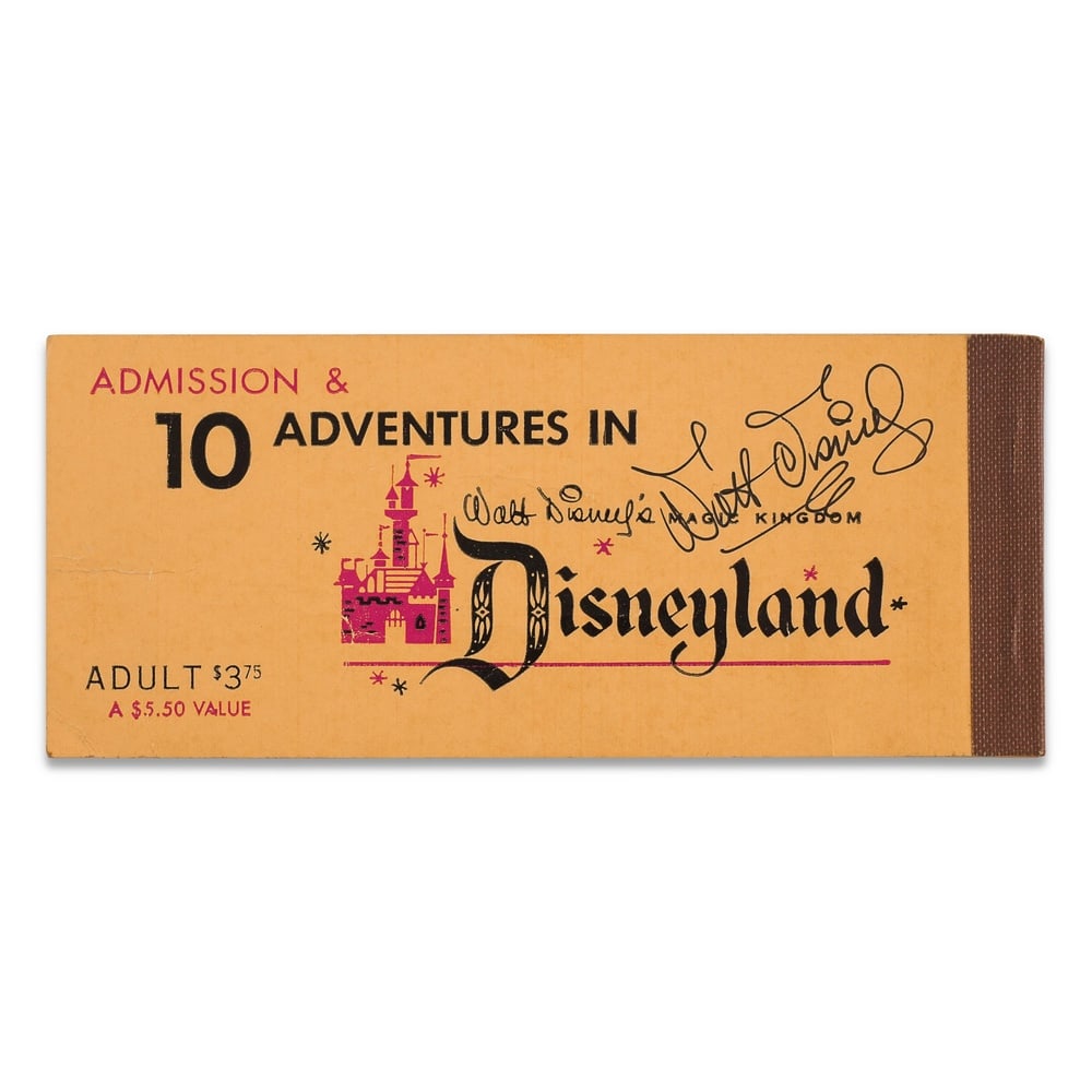 WALT DISNEY SIGNED DISNEYLAND TICKET BOOKLET COVER: 6 1/8 x 2 1/2 in (15.5 x 6.5 cm) Provenance and Authentication: This collectible has undergone a rigorous forensic evaluation. The signatures were carefully analyzed across multiple criteria,
