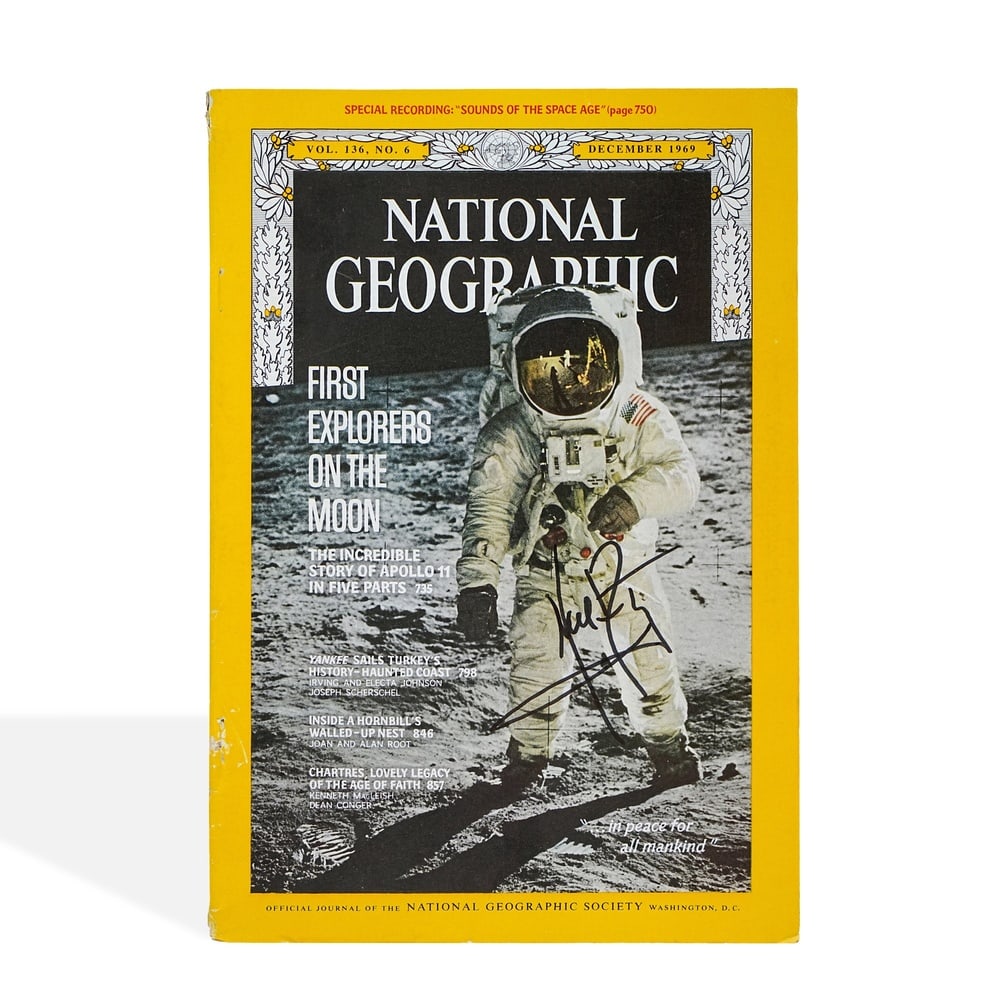 NEIL ARMSTRONG SIGNED NATIONAL GEOGRAPHIC MAGAZINE (DECEMBER 1969): 10 x 6 7/8 in (25.3 x 17.5 cm) Neil Armstrong stands as one of the most consequential figures in human history. As the first human to step onto the surface of the Moon during the Apollo 11 mission in