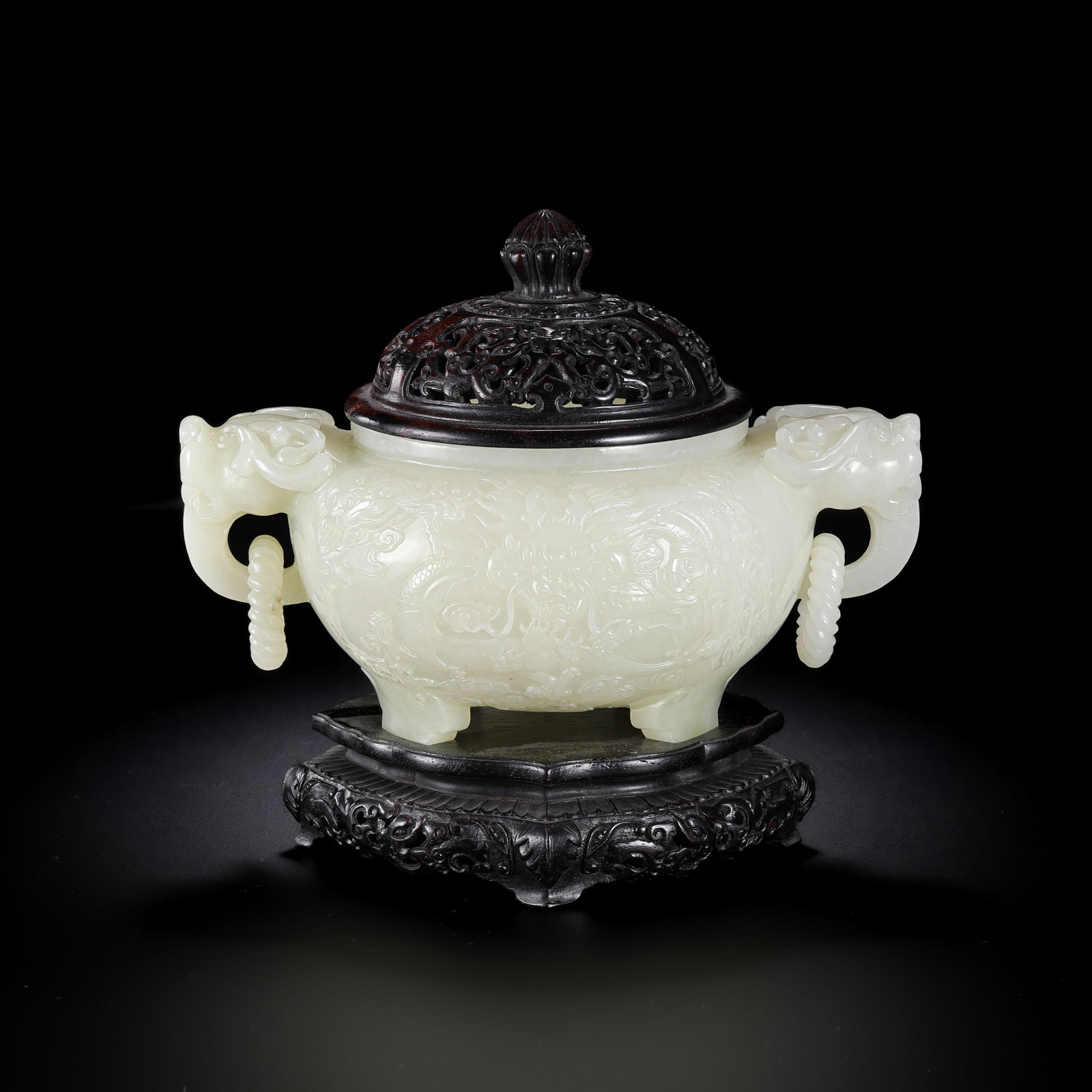 Chinese Qing Dynasty Hetian white jade tripod censer with double ring handles: H. 17.5 cm. W. 19.5 cm. Weight. 1165 gram.