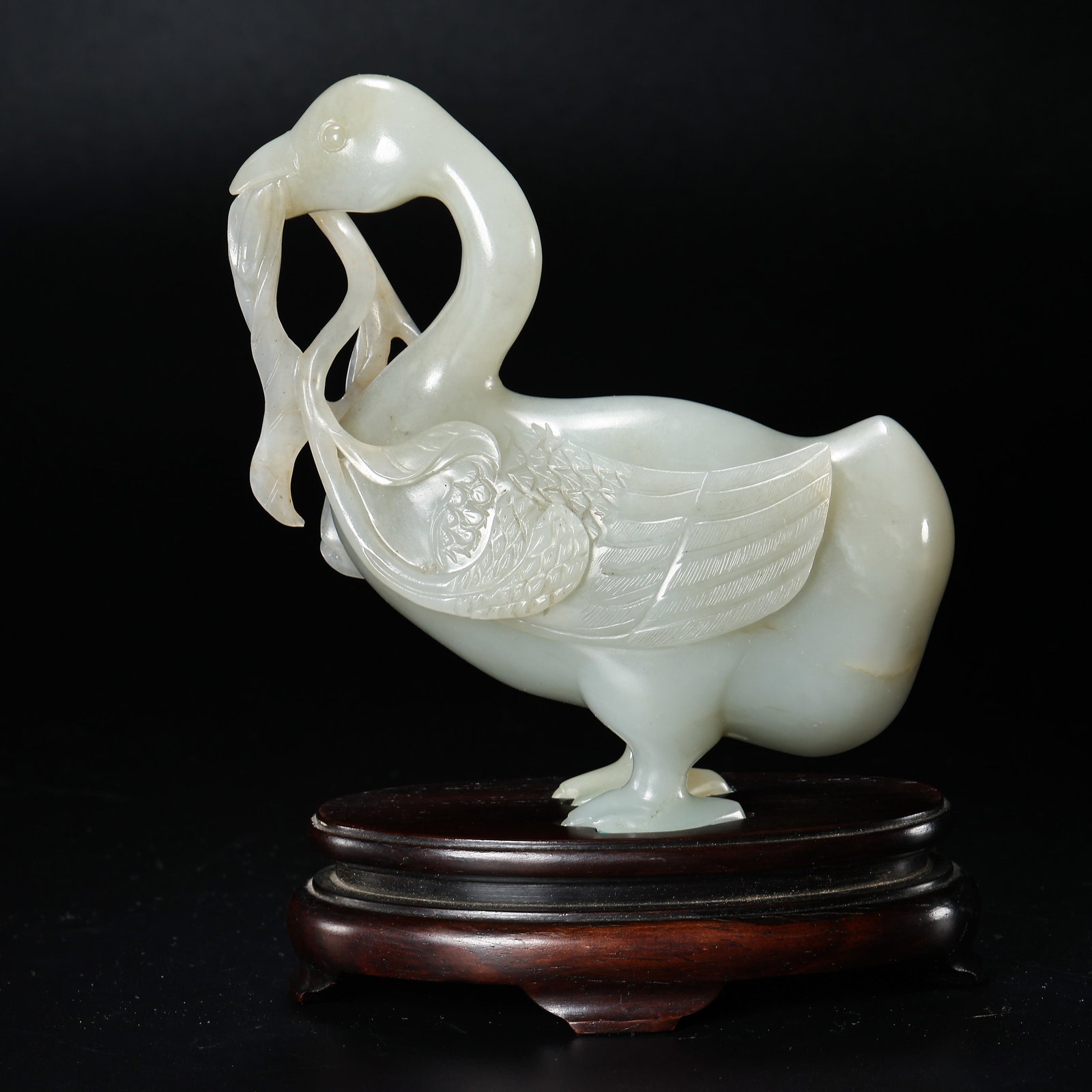 Chinese Qing Dynasty Hetian jade duck-shaped ornament with a branch: H. 14 cm. W. 10.5 cm. Weight. 459 gram.