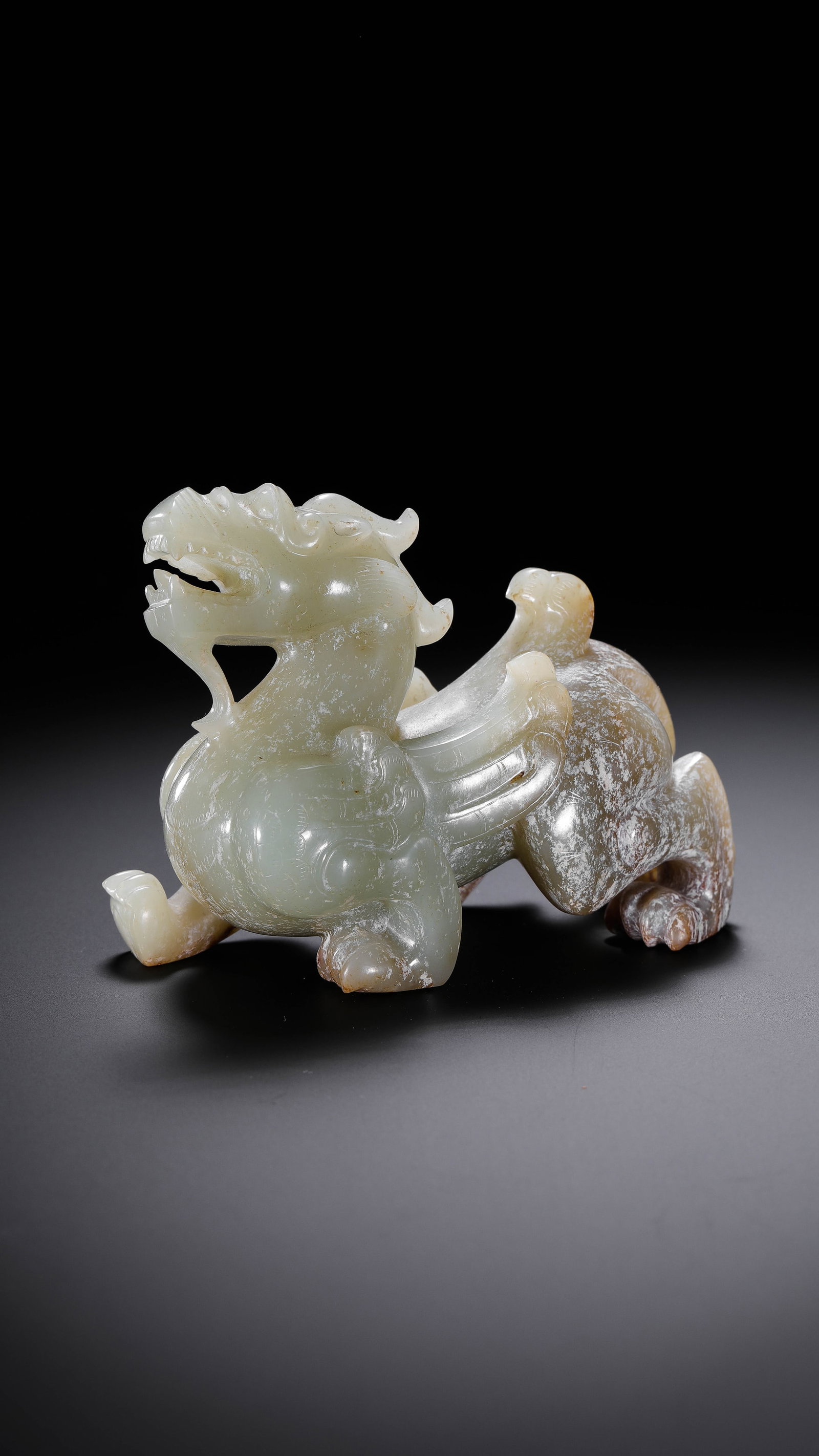 Chinese Han Dynasty Hetian Jade Bixie: H. 7.1 cm. W. 9.7 cm. Weight. 272 gram.