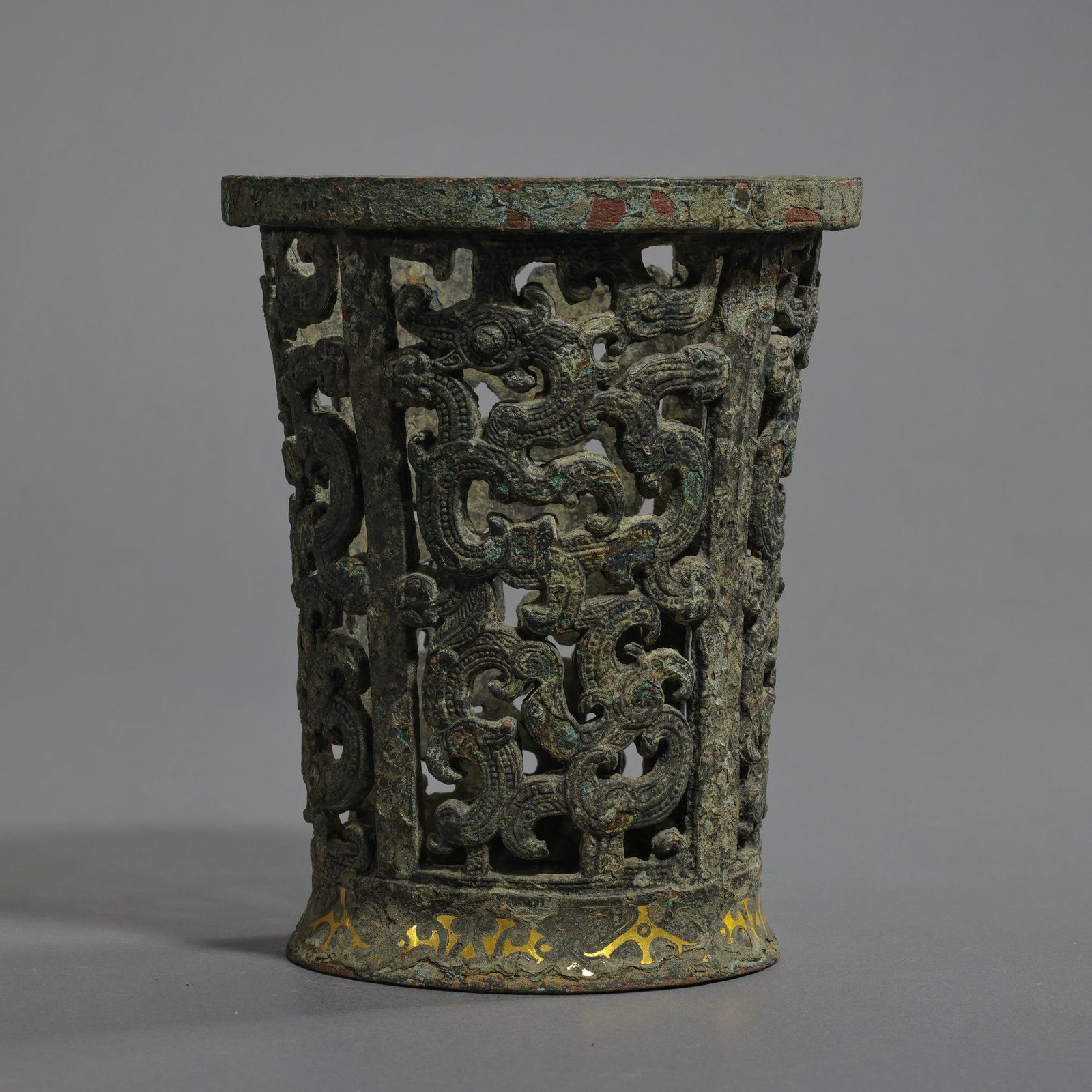 Openwork cylindrical shape with gold inlay from the Warring States period of China: H. 13.6 cm. W. 11 cm. Weight. 741 gram.