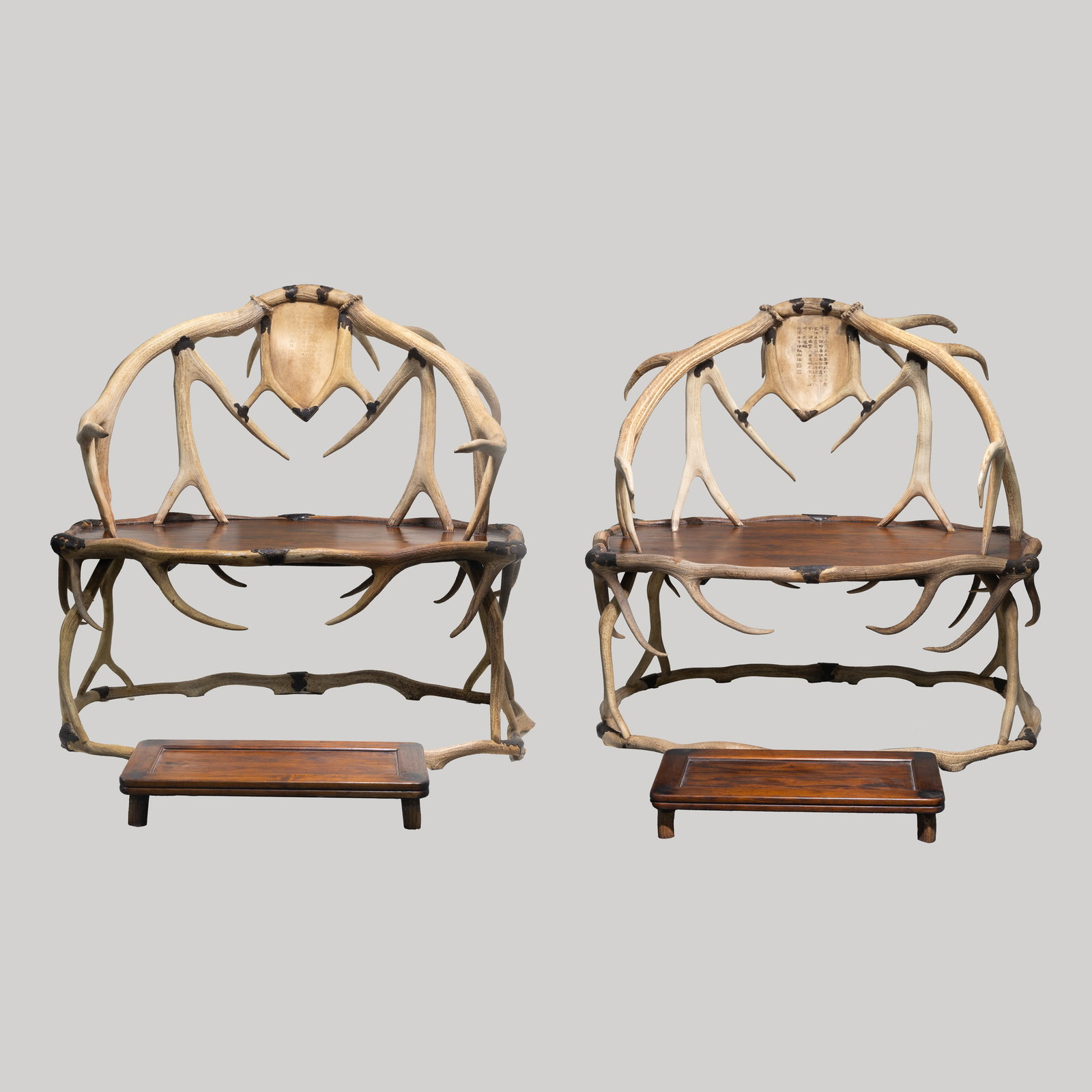 A pair of Chinese antler chairs from the Qianlong period of the Qing Dynasty: H. 108 cm. L. 110 cm.