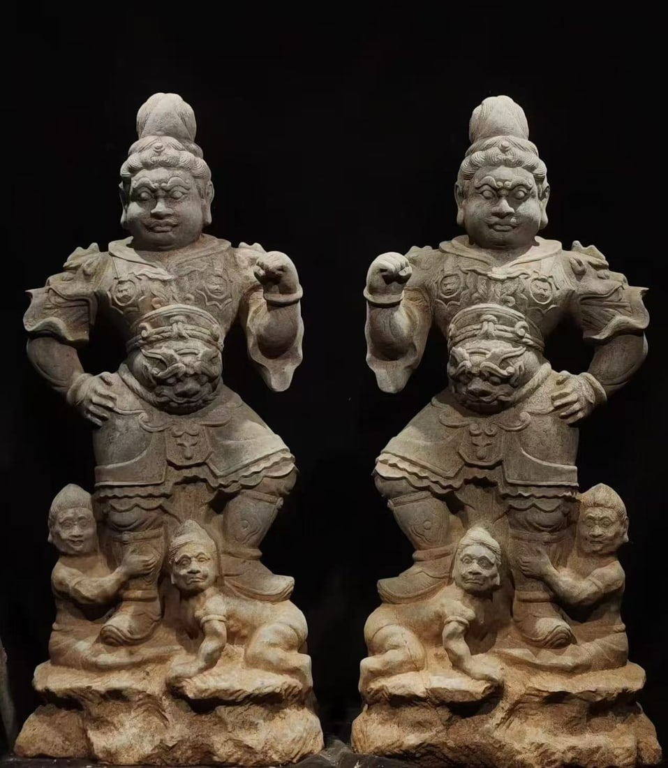 A pair of Chinese Tang Dynasty bluestone standing statues of Heavenly Kings: L. 45 cm. W. 35 cm. H. 100 cm.