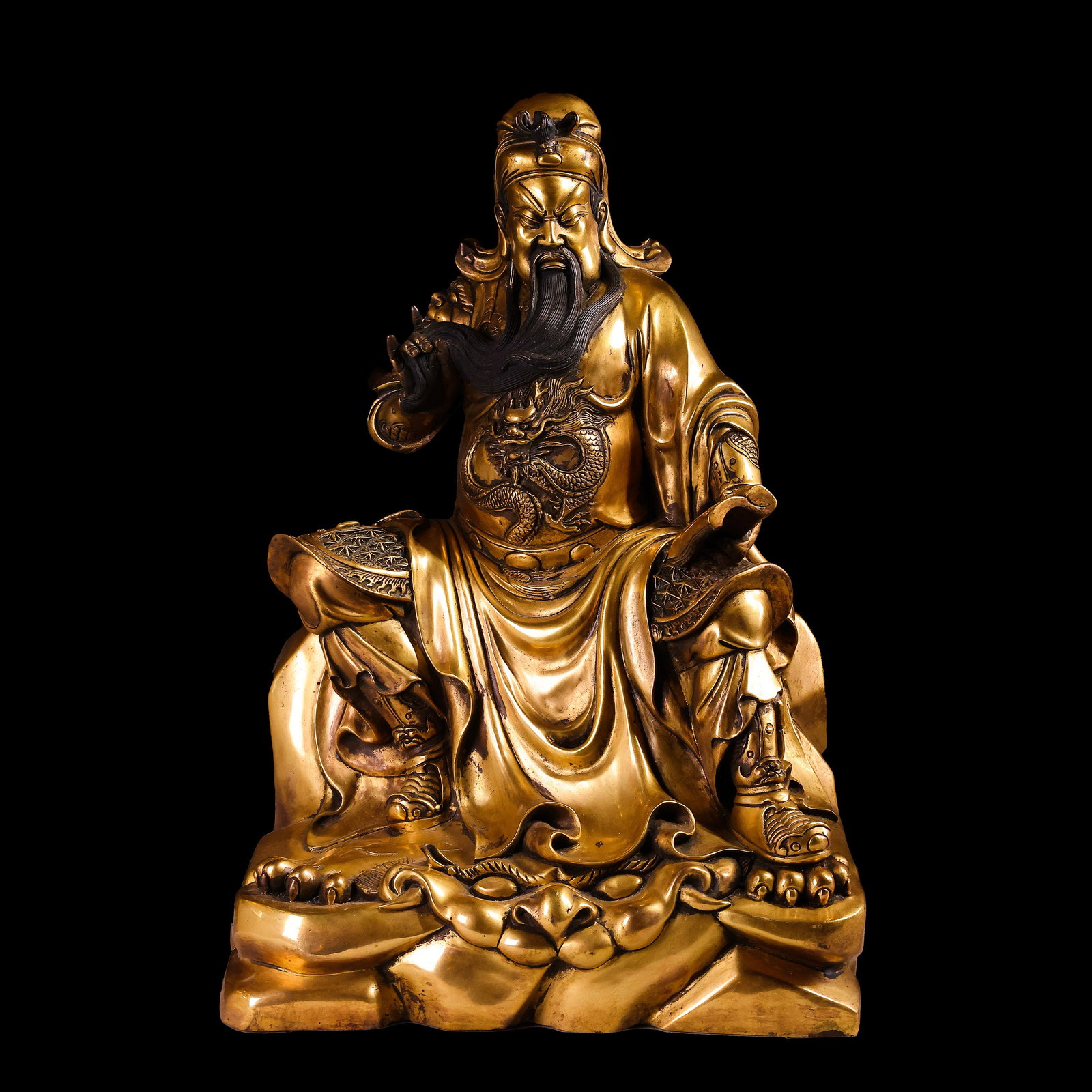 A gilt bronze seated statue of Guan Yu from the Ming Dynasty in China.: H. 41 cm. W. 25.5 cm. Weight. 11300 gram.