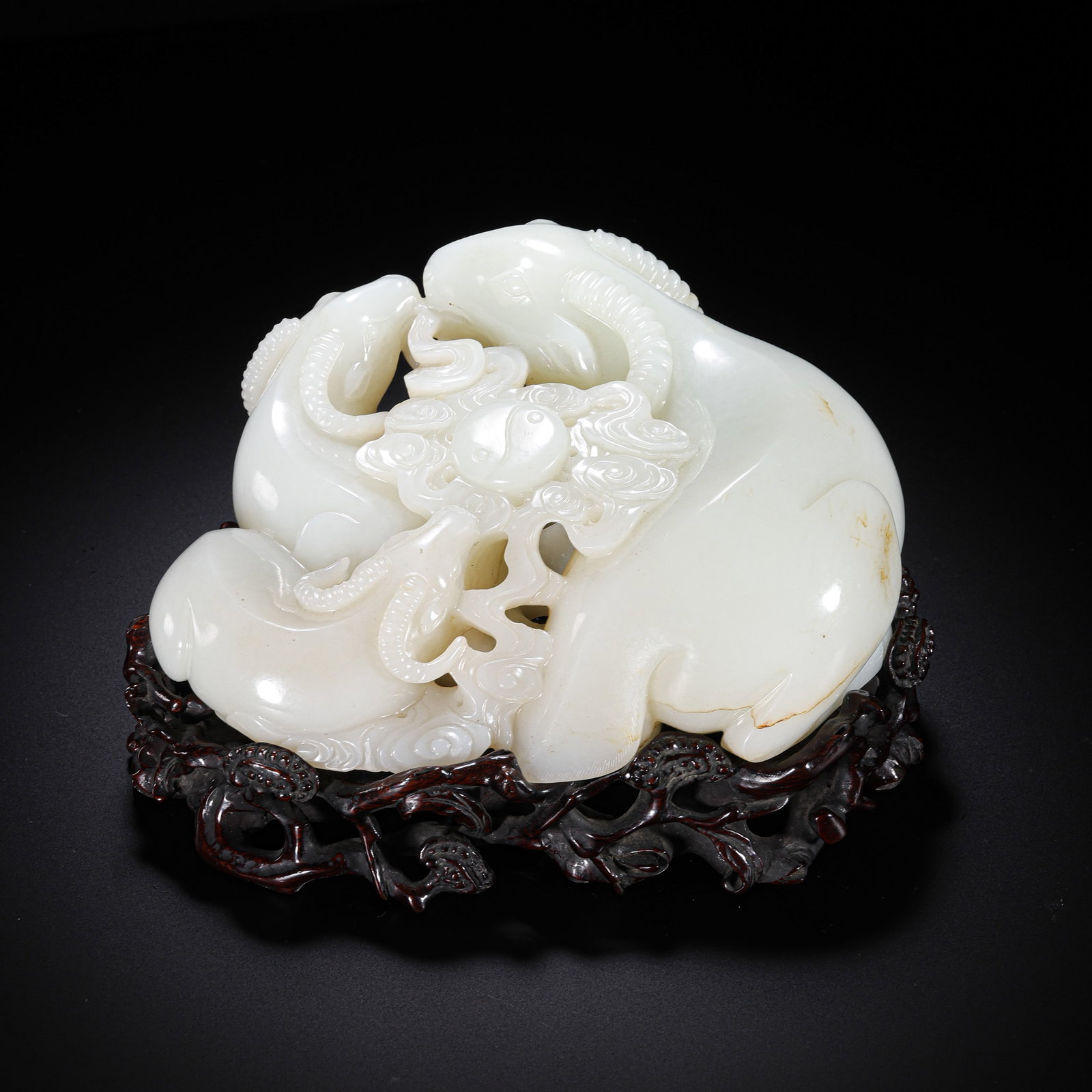 Three Rams Bringing Prosperity Ornament, Hetian White Jade from the Qing Dynasty, China: H. 11 cm. W. 19 cm. Weight. 2153 gram.
