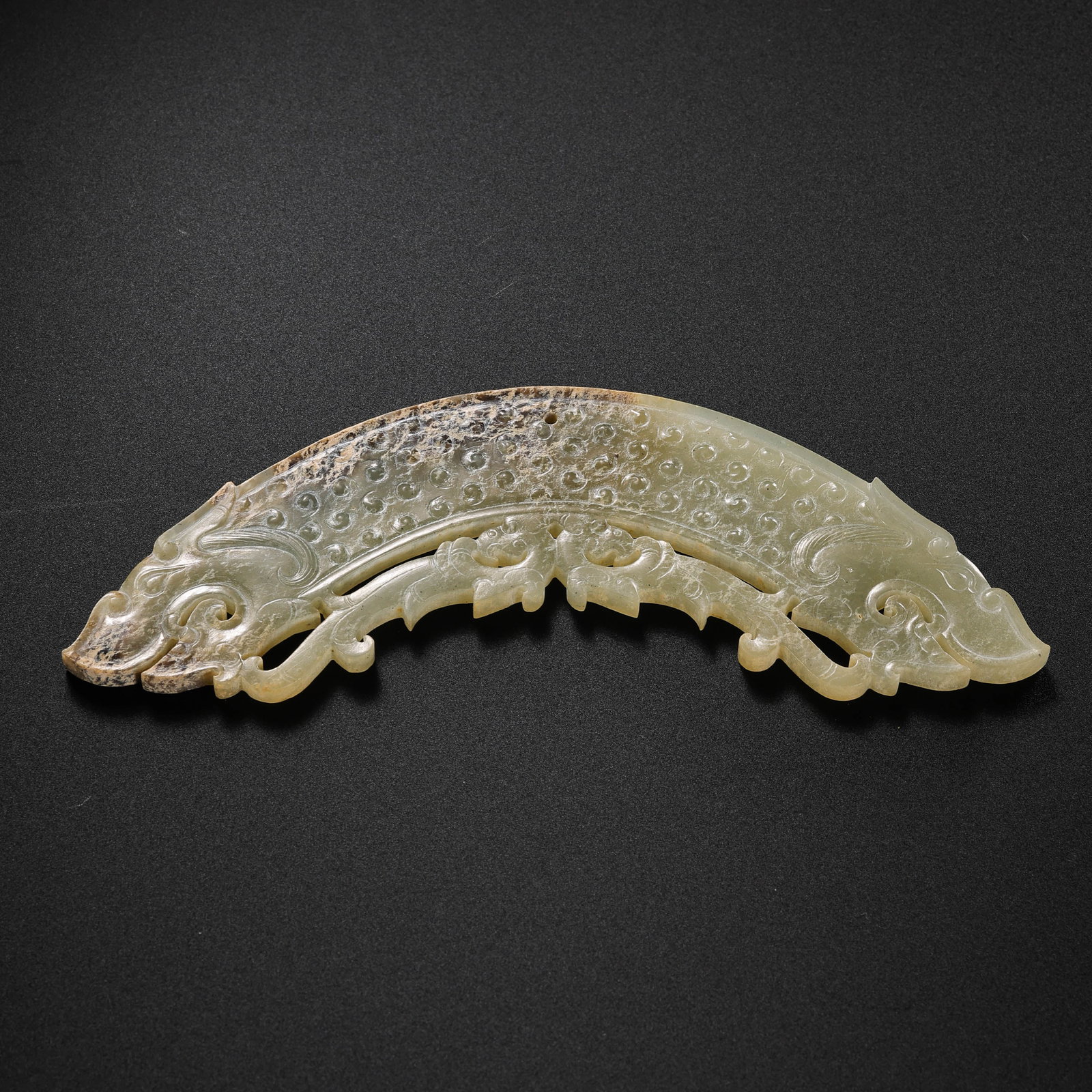 Jade huang from the Han Dynasty in China: L. 11.7 cm. W. 3 cm. Weight. 29 gram.