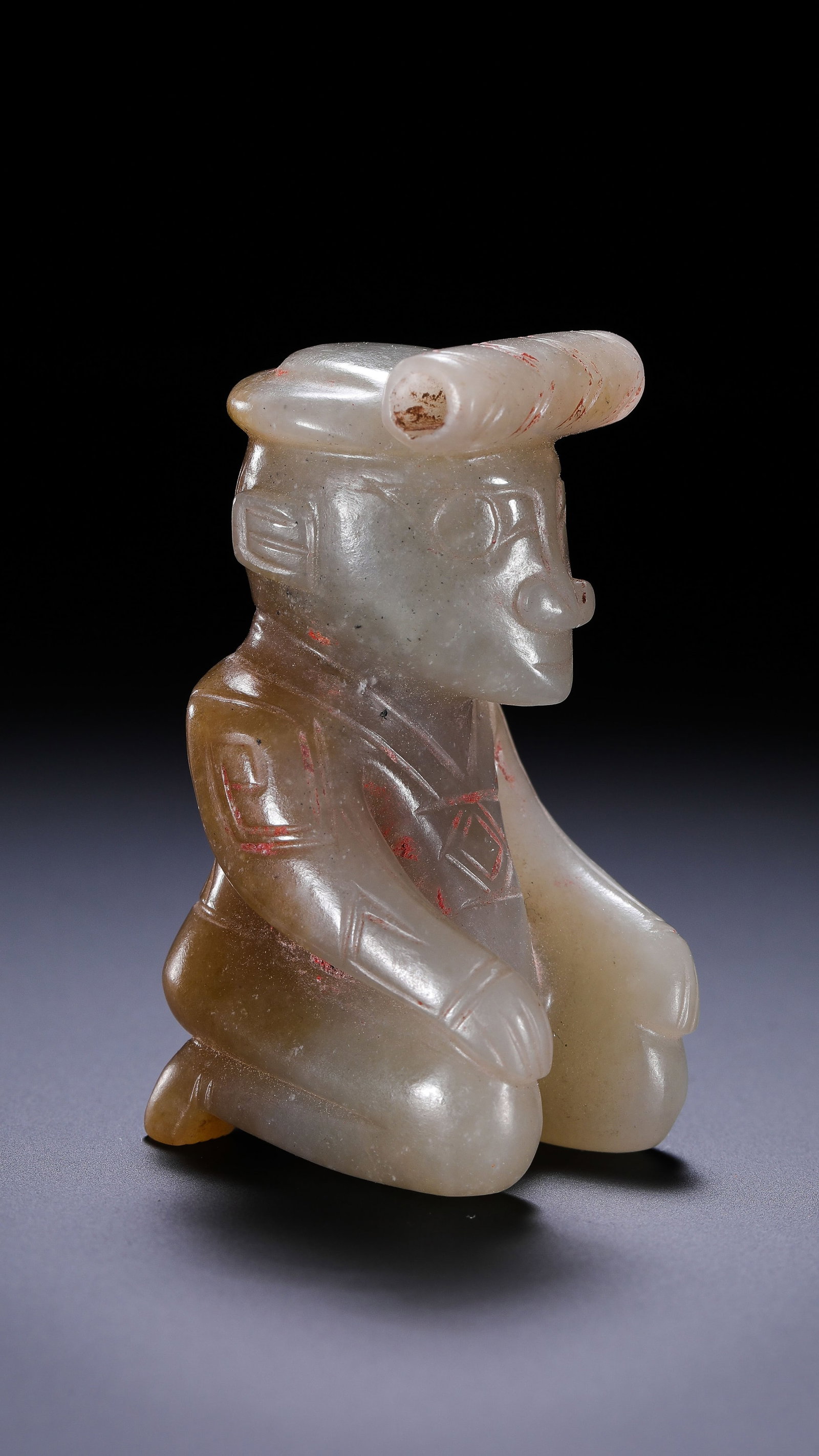 Jade kneeling figure from the Western Zhou Dynasty in China: H. 5.3 cm. W. 2.8 cm. Weight. 57 gram.