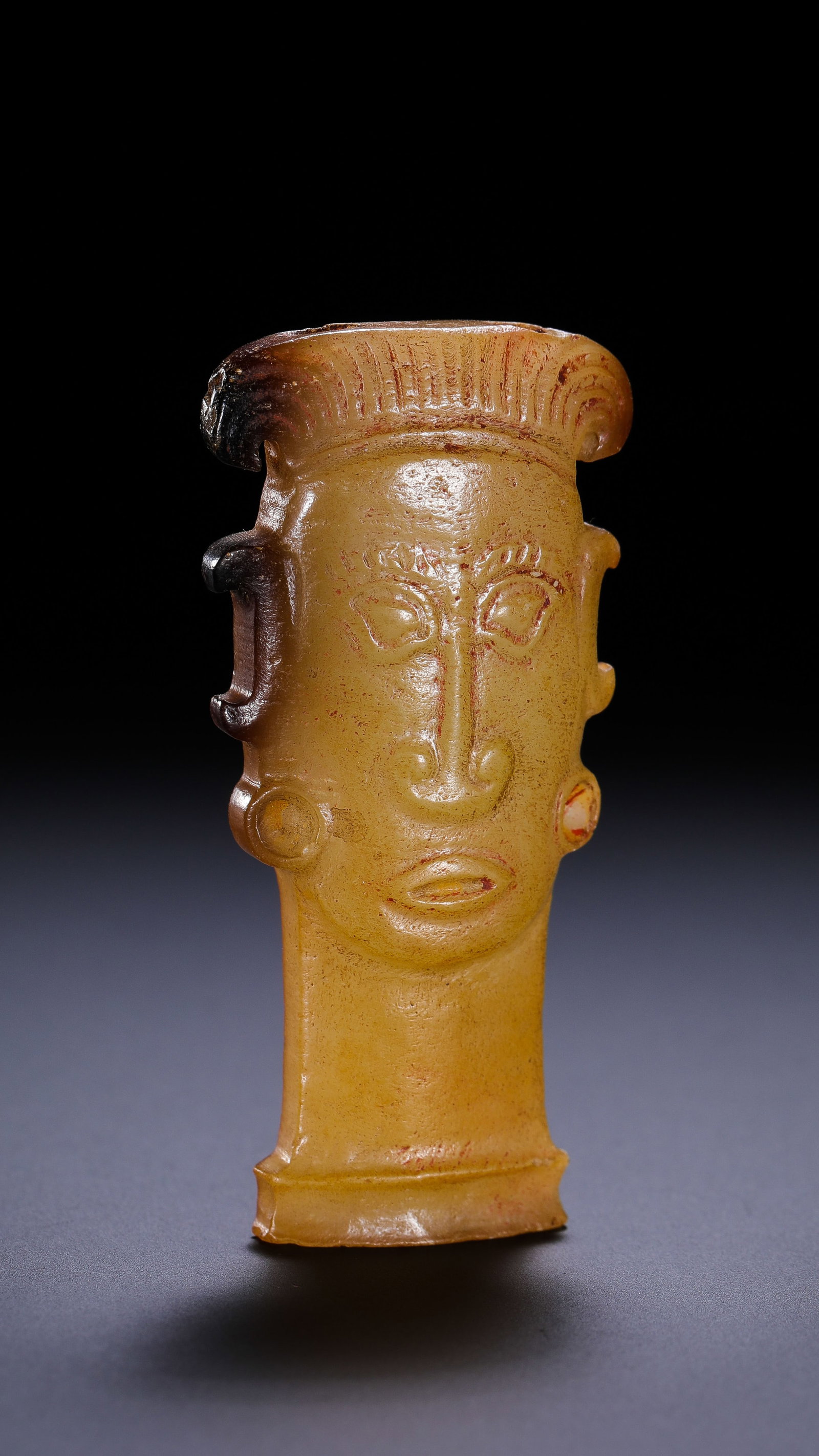 Jade human face from the Han Dynasty in China: H. 5.3 cm. W. 2.5 cm. Weight. 16 gram.