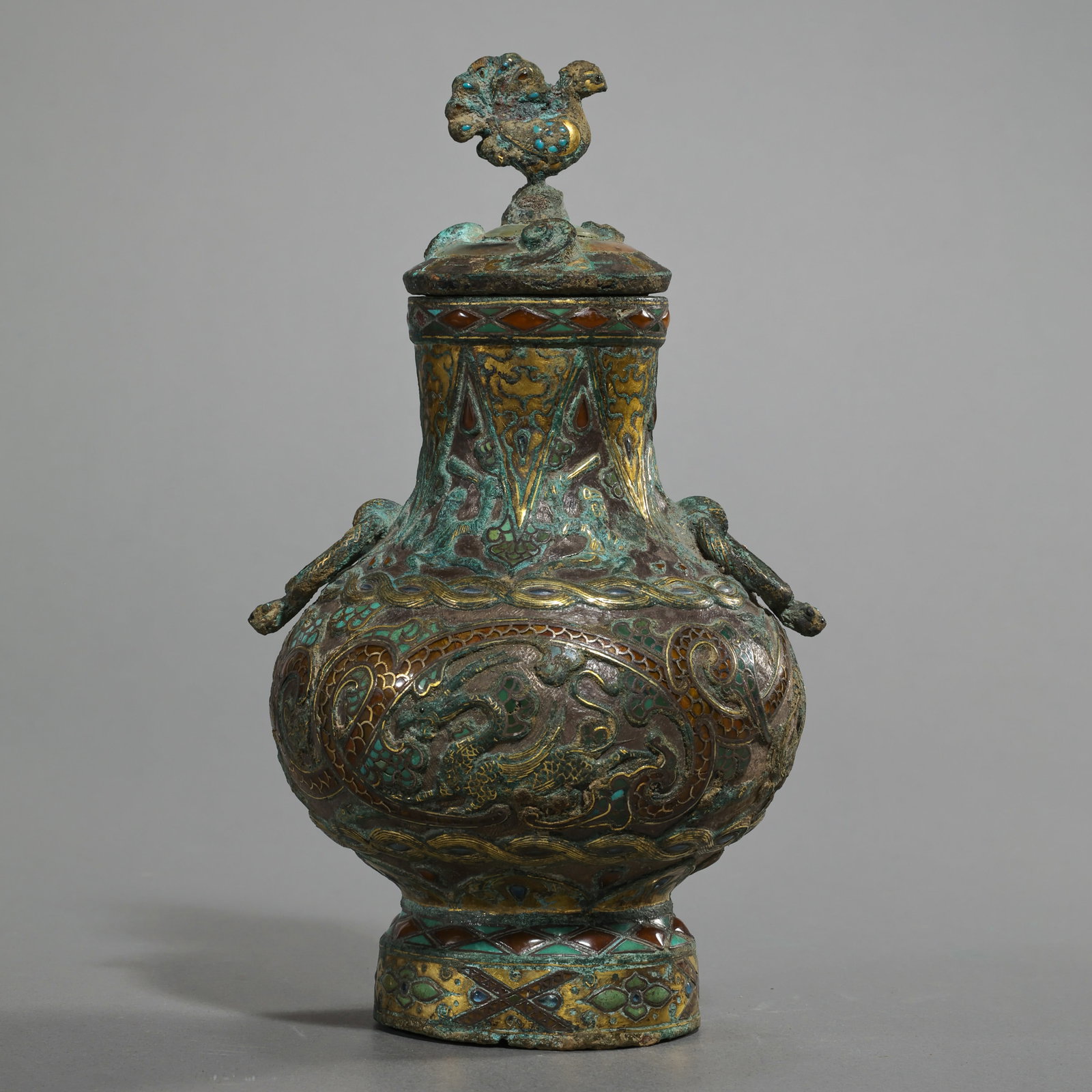 Gold and silver inlaid lidded ewer from the Warring States period of China: H. 7.5 cm. Weight. 520 gram.