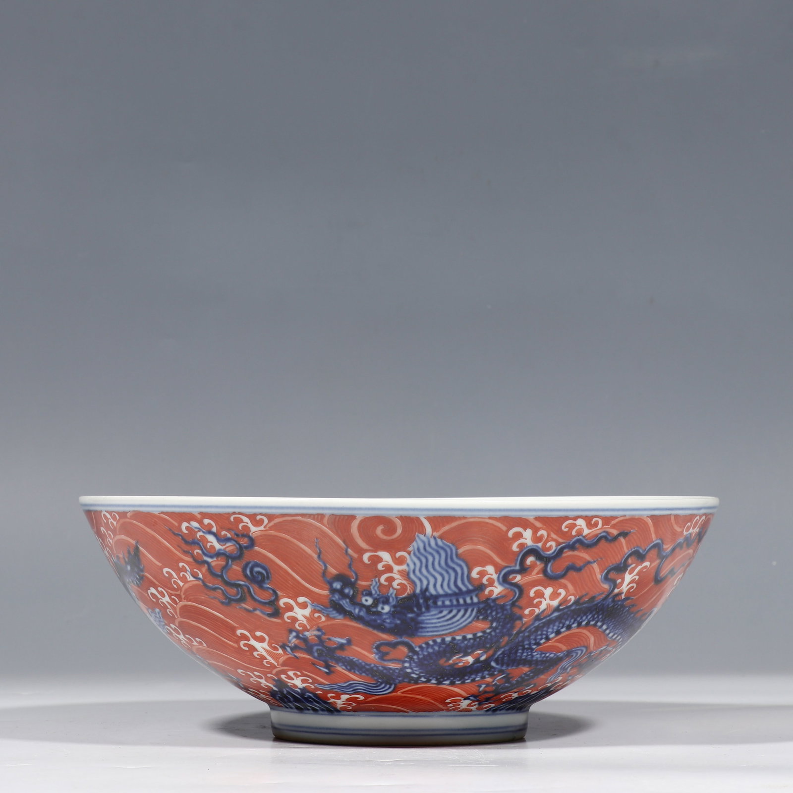 Chinese Ming Dynasty Xuande Period Iron-Red and Blue-and-White Dragon Pattern Plate: H. 9.5 cm. Diam. 25.3 cm.