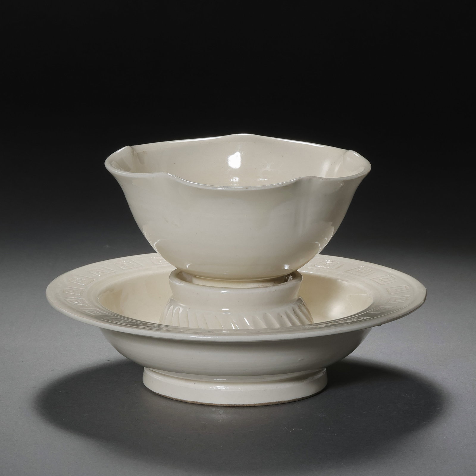 A set of flower-shaped cups and saucers from the Ding kiln of the Northern Song Dynasty in China: H. 9 cm. W. 13.5 cm.