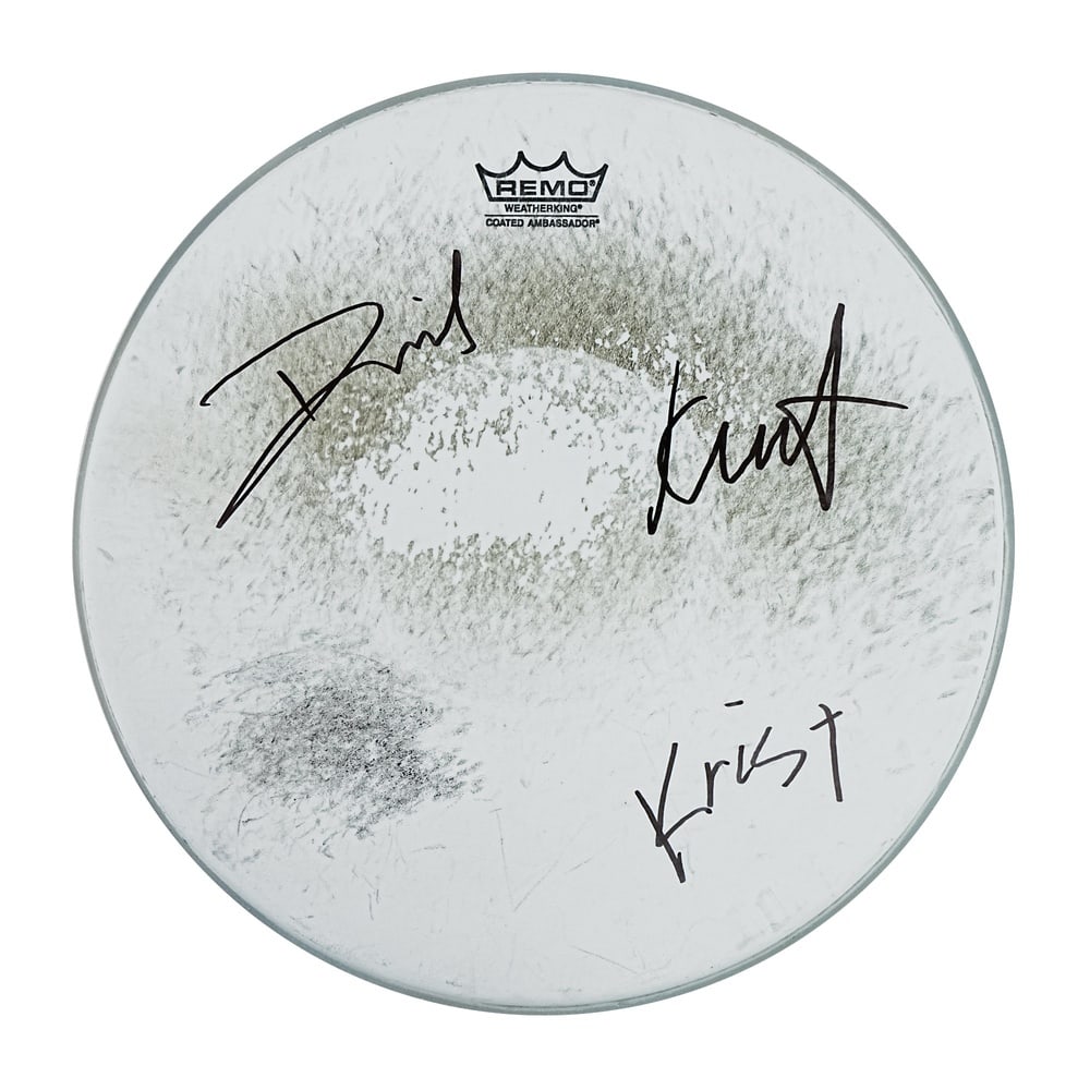 NIRVANA CLASSIC LINEUP SIGNED DRUMHEAD: Diameter 14 in (35.5 cm) Nirvana remains one of the most influential bands in modern music history, and artifacts bearing the signatures of the group's classic lineup continue to attract strong