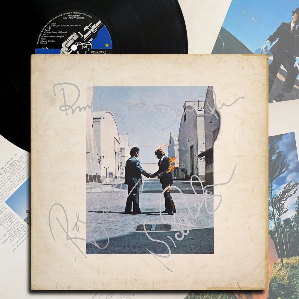 PINK FLOYD FULLY SIGNED "WISH YOU WERE HERE" LP: 12 1/4 x 12 1/4 in Provenance and Authentication: This collectible has undergone a rigorous forensic evaluation. The signatures were carefully analyzed across multiple criteria, including ink depositi