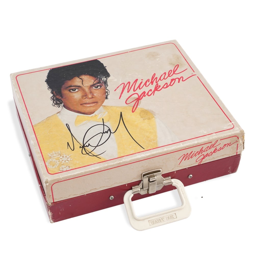 MICHAEL JACKSON SIGNED PORTABLE PHONOGRAPH RECORD PLAYER: 12 3/8 x 10 3/8 x 3 5/8 in (31.5 x 26.5 x 9.2 cm) Provenance and Authentication: This collectible has undergone a rigorous forensic evaluation. The signatures were carefully analyzed across multiple c