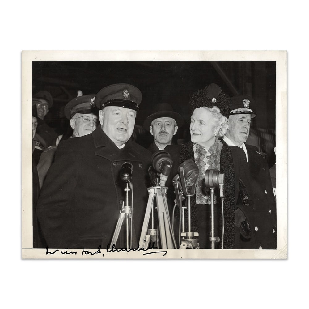 WINSTON CHURCHILL SIGNED PRESS PHOTOGRAPH: 8 1/2 x 6 5/8 in (21.5 x 16.8 cm) Provenance and Authentication: According to the accompanying documentation provided by the consignor, the signatures have been examined with reference to multiple fac