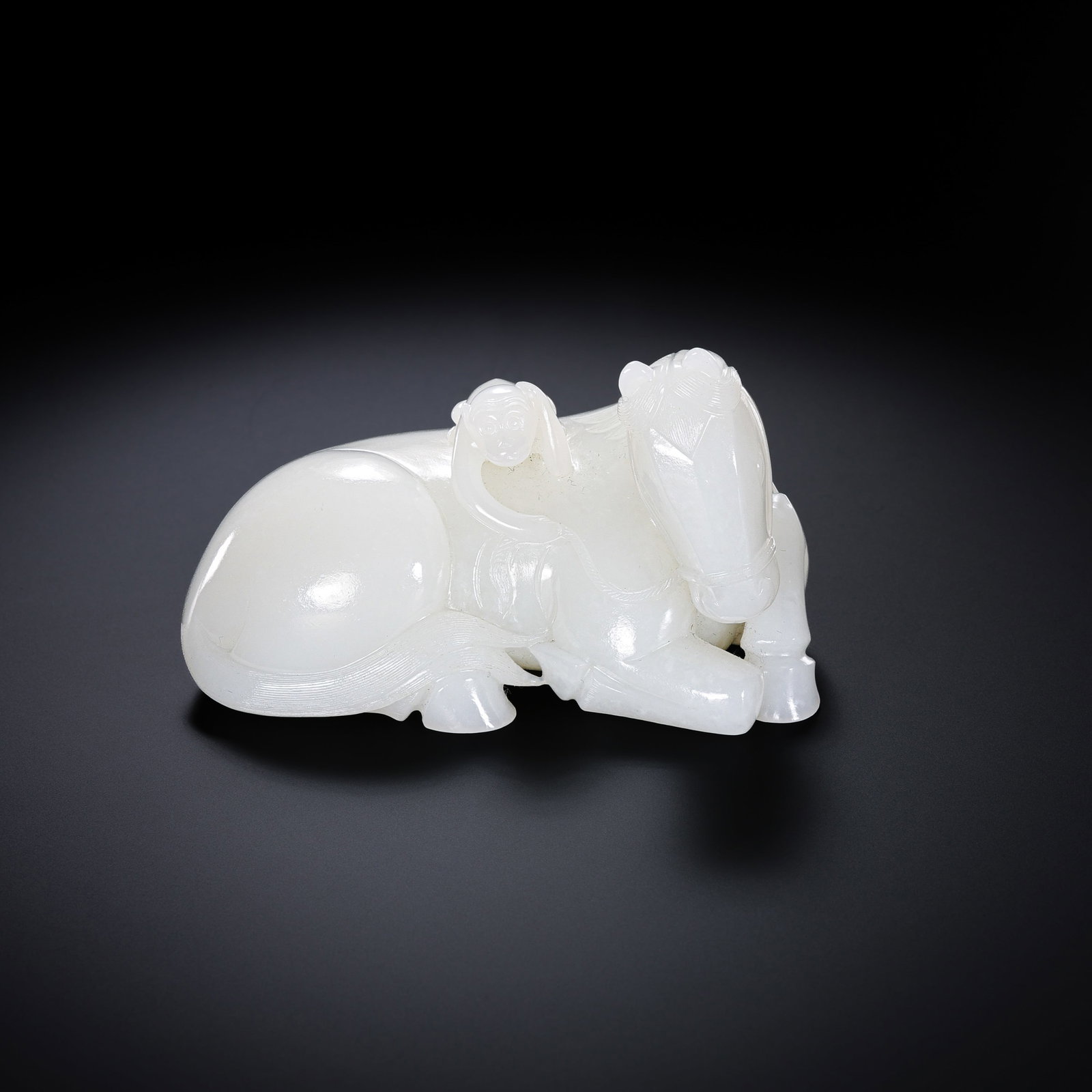 Chinese Qing Dynasty Hetian white jade reclining horse: H. 6 cm. W. 9.5 cm. Weight. 369 gram.