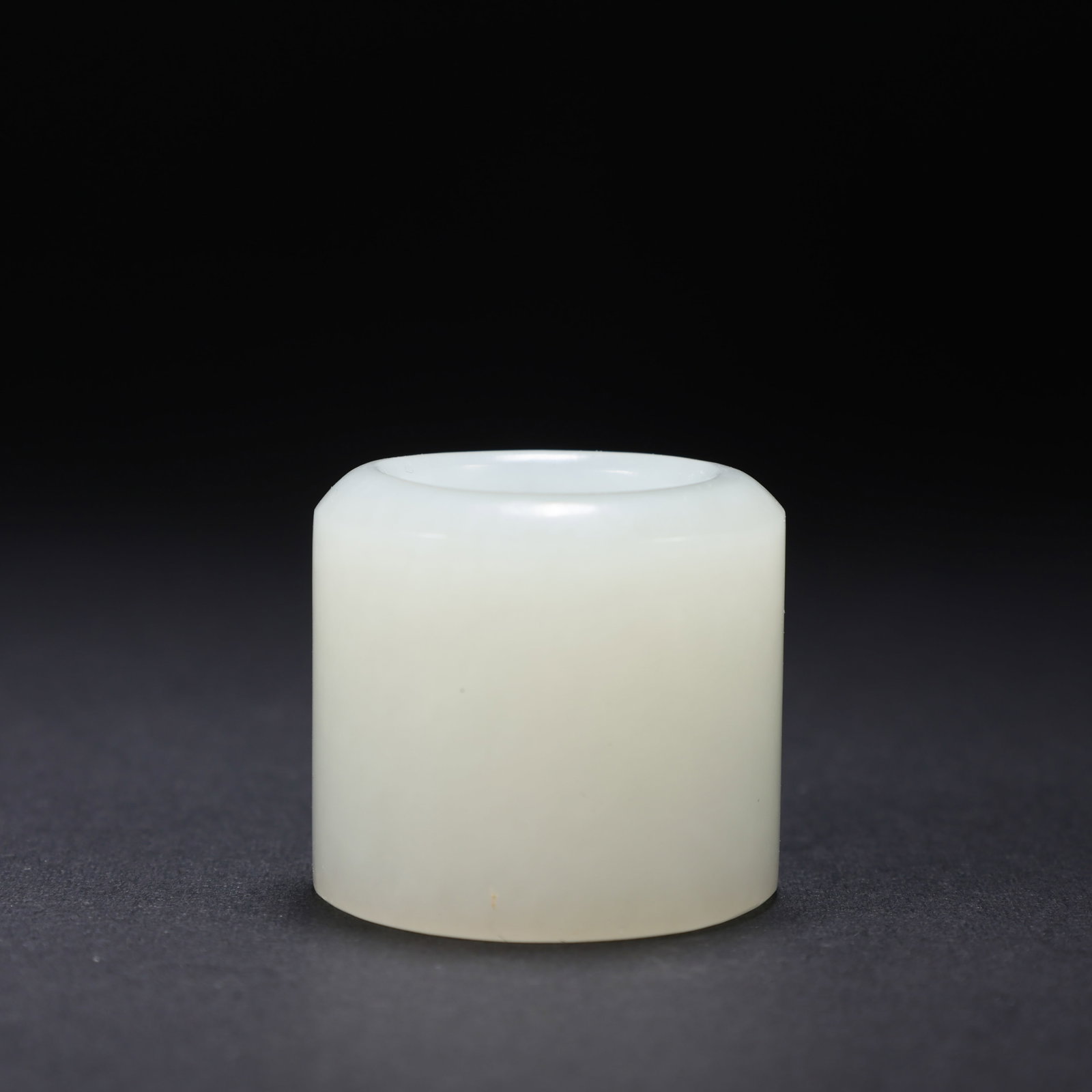 Chinese Qing Dynasty Hetian white jade thumb ring: H. 3.4 cm. W. 3.4 cm. Weight. 49 gram.