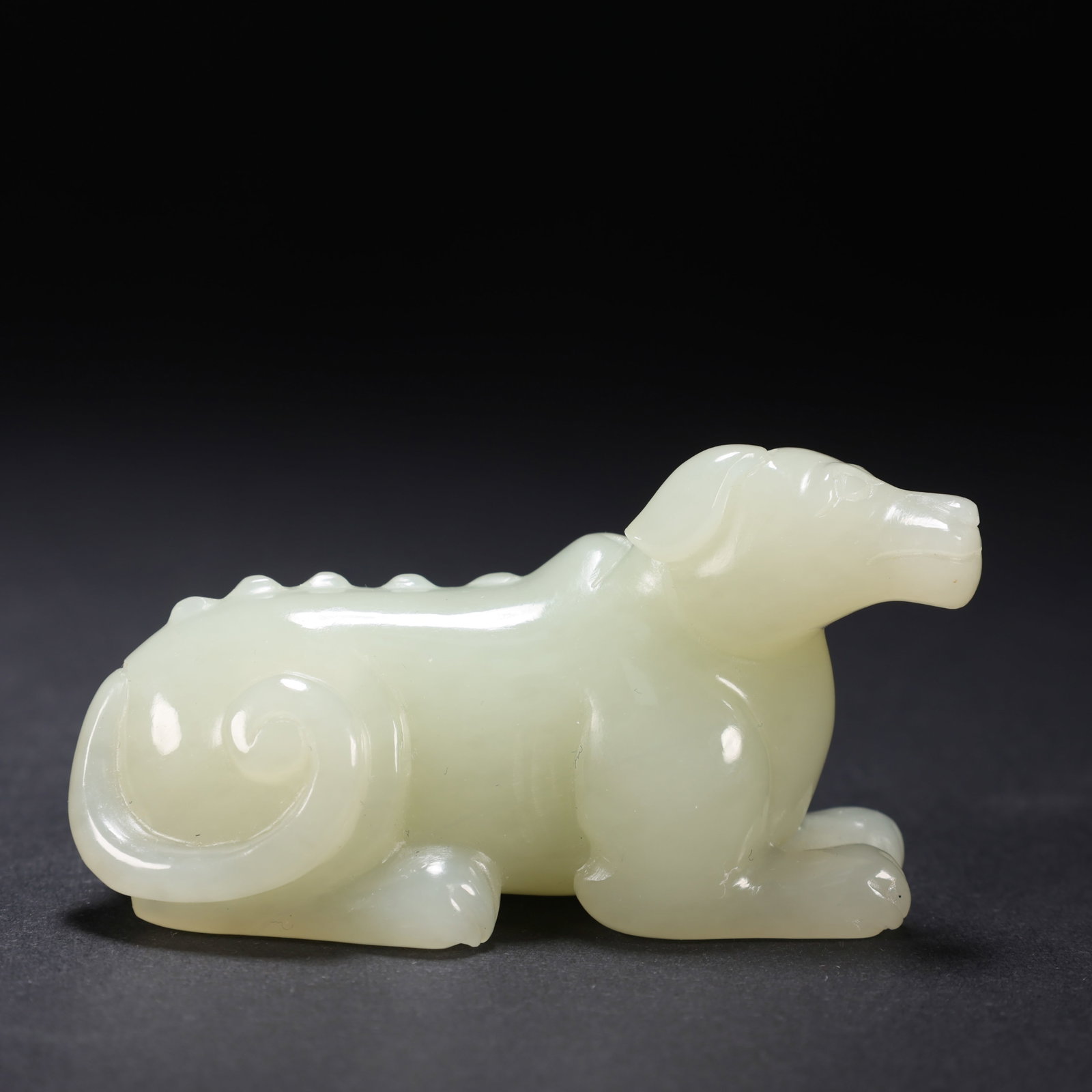 Chinese Qing Dynasty Hetian Jade Dog: L. 6.5 cm. W. 2.2 cm. H. 3.4 cm. Weight. 61 gram.