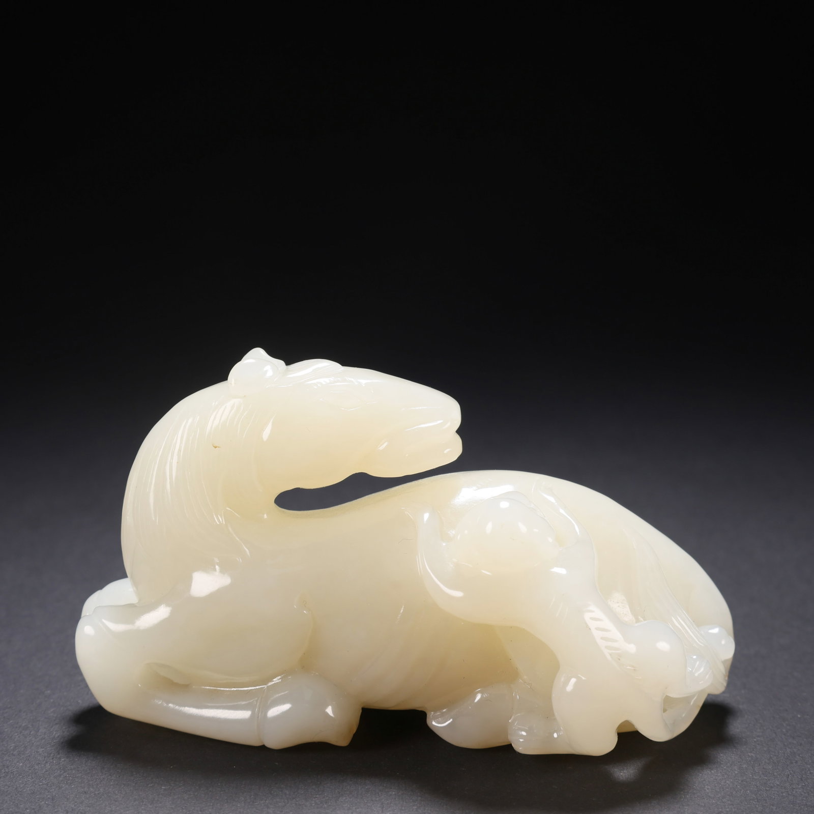 Hetian Jade Horse from the Qianlong Period of the Qing Dynasty, China: L. 9.2 cm. W. 4.3 cm. H. 5.2 cm. Weight. 190 gram.