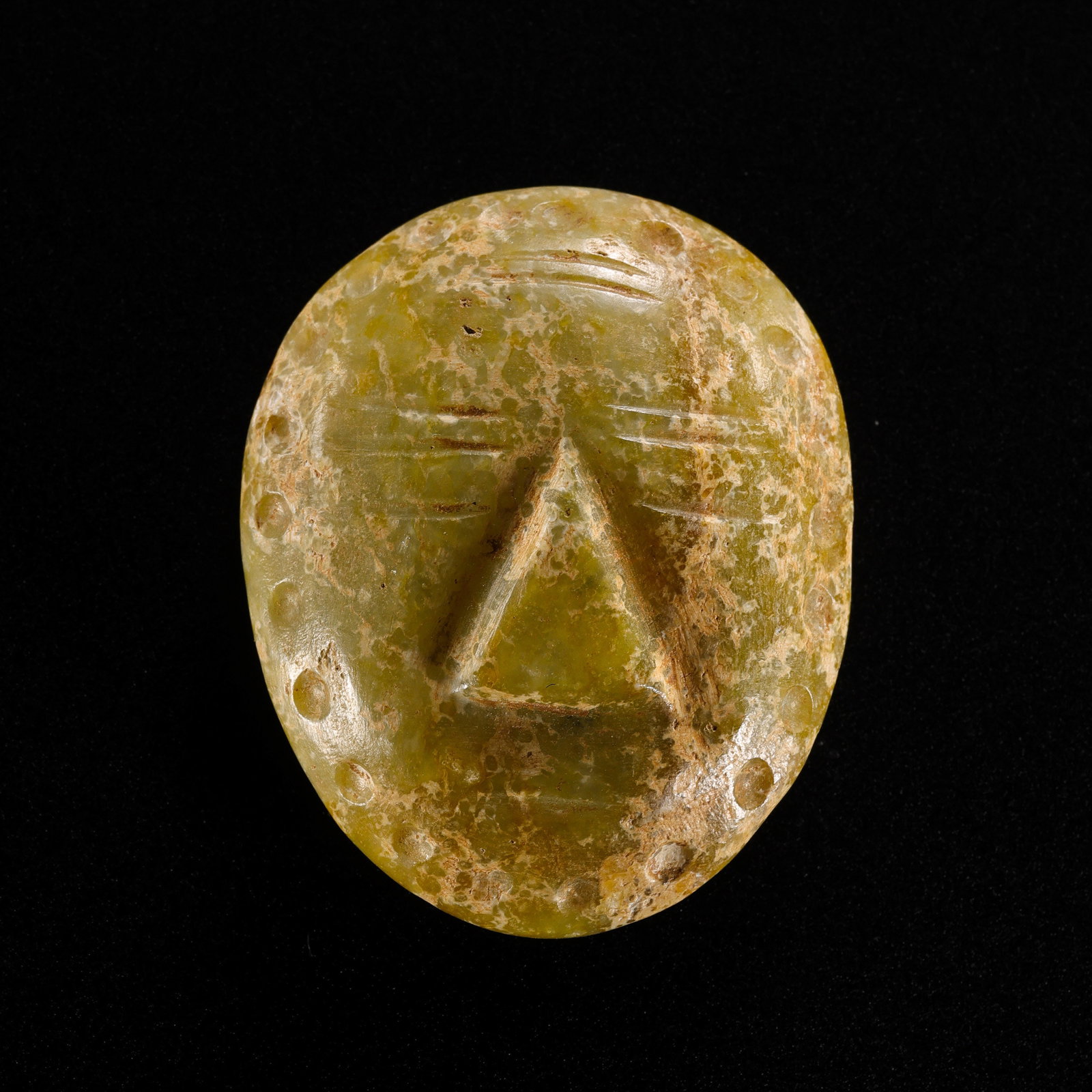 Jade face of Hongshan Culture during the Hongshan period in China: L. 4.5 cm. Weight. 31 gram.