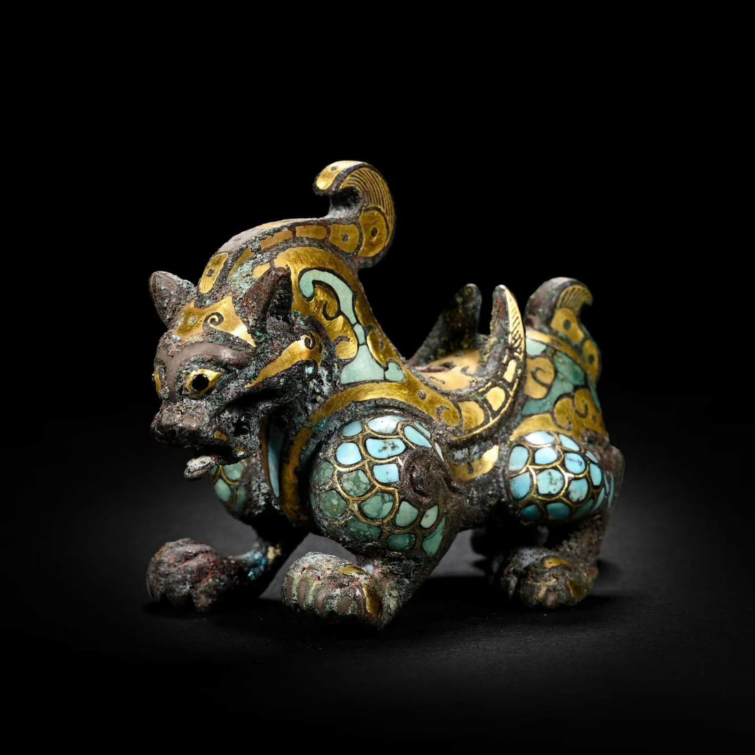 Gold and silver inlaid auspicious beasts from the Warring States period of China: /