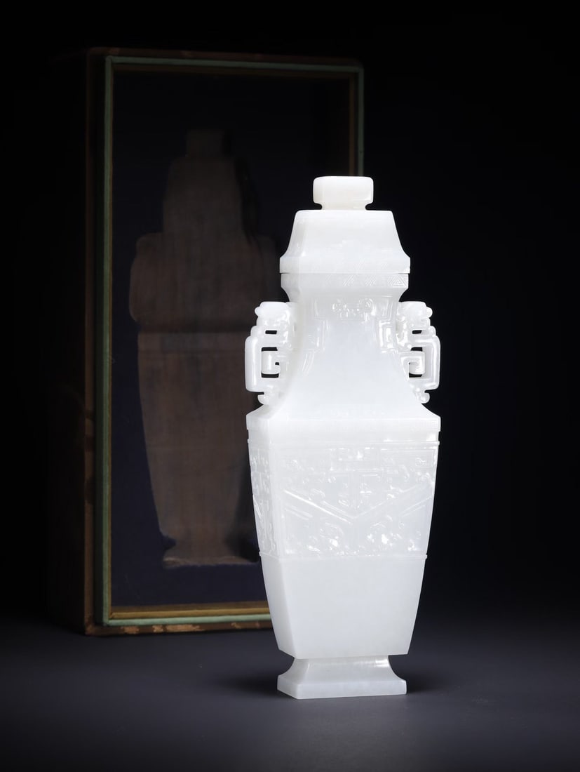 Chinese Qing Dynasty Hetian white jade double-eared covered vase with animal mask design: /