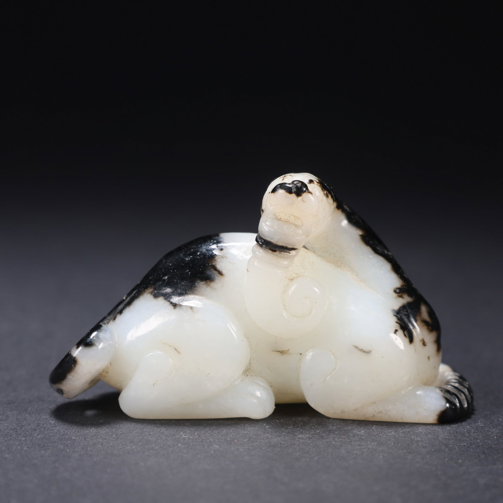 Jade auspicious beasts from Hetian in the Qing Dynasty, China: L. 6.3 cm. W. 2.2 cm. H. 3.6 cm. Weight. 55 gram.