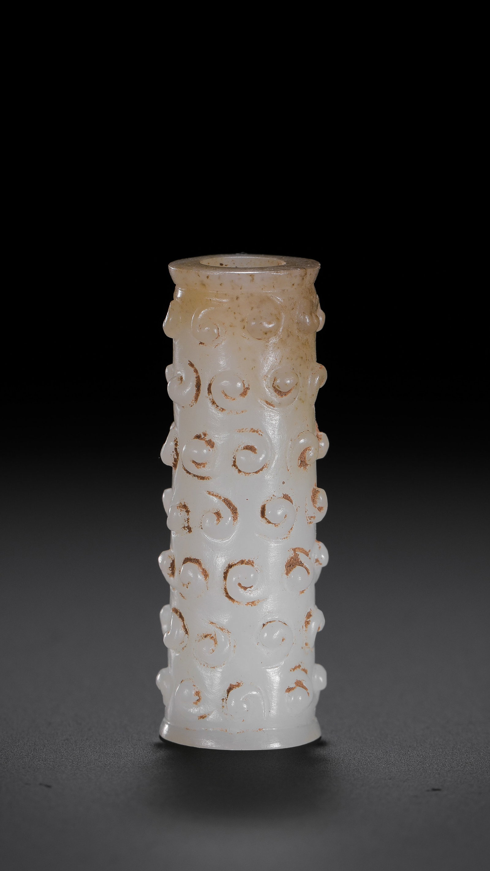 Jade pendant with cloud pattern from the Warring States period of China: L. 3.7 cm. W. 1.3 cm. Weight. 9 gram.
