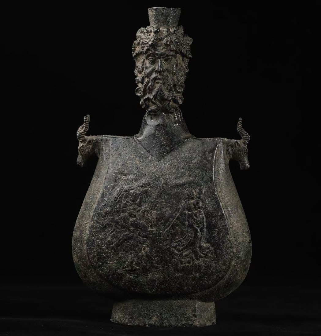 Achaemenid Dynasty Bronze Flask with Dionysus Head: L. 18 cm. W. 9 cm. H. 33 cm.