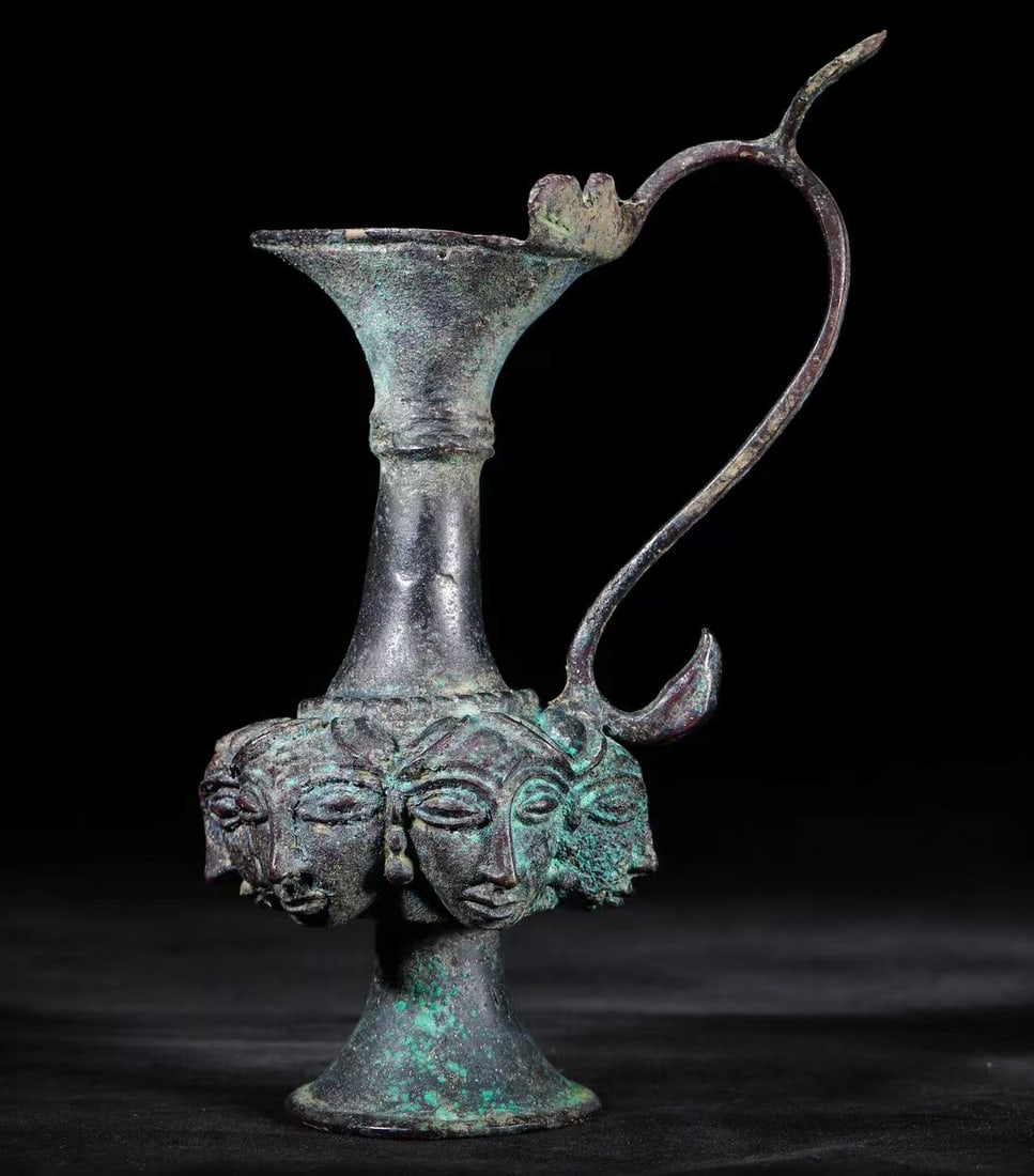 Ancient Persian Culture Bronze Ewer with Human Face and Phoenix Handle: L. 17 cm. W. 10 cm. H. 24 cm.