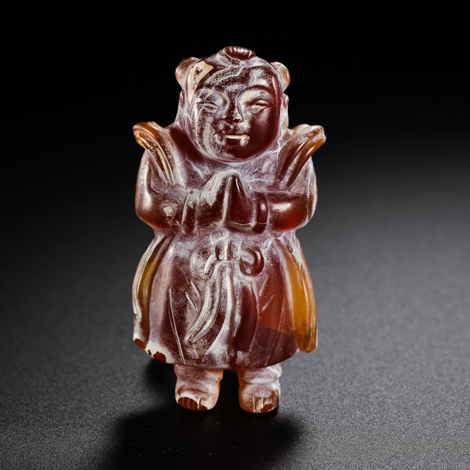 Red agate figurine from the Liao Dynasty in China: H. 4.5 cm. Weight. 16 gram.