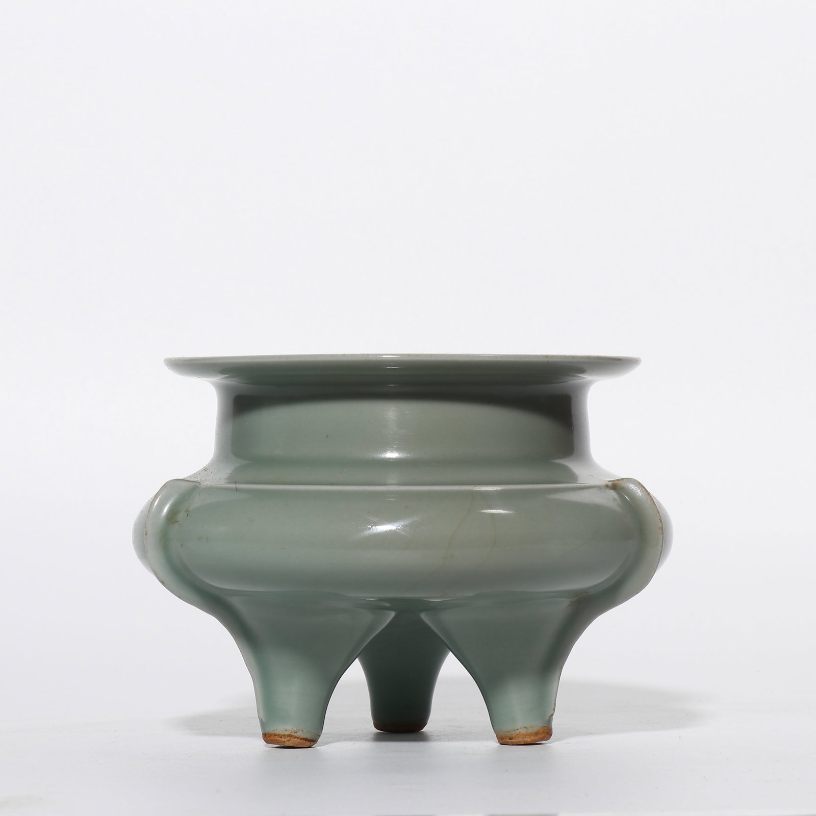 A celadon tripod censer from the Longquan kiln in the Southern Song Dynasty, China.: H. 11.2 cm. Diam. 13.6 cm.