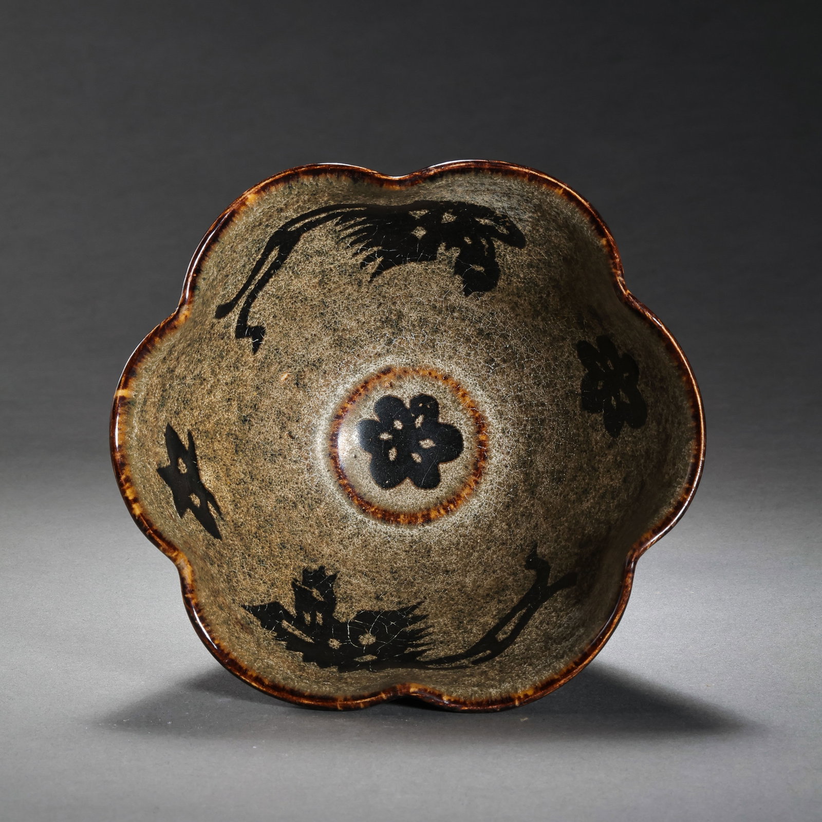 Chinese Southern Song Dynasty Jizhou Kiln Paper-cut AppliquÃ© Phoenix Pattern Flower-shaped Cup: H. 6 cm. Diam. 11.5 cm.