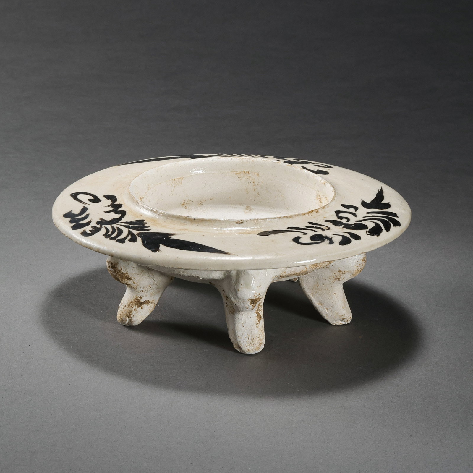 A white-glazed, black-decorated incense burner from the Cizhou kiln of the Northern Song Dynasty in: H. 5.5 cm. Diam. 14 cm.