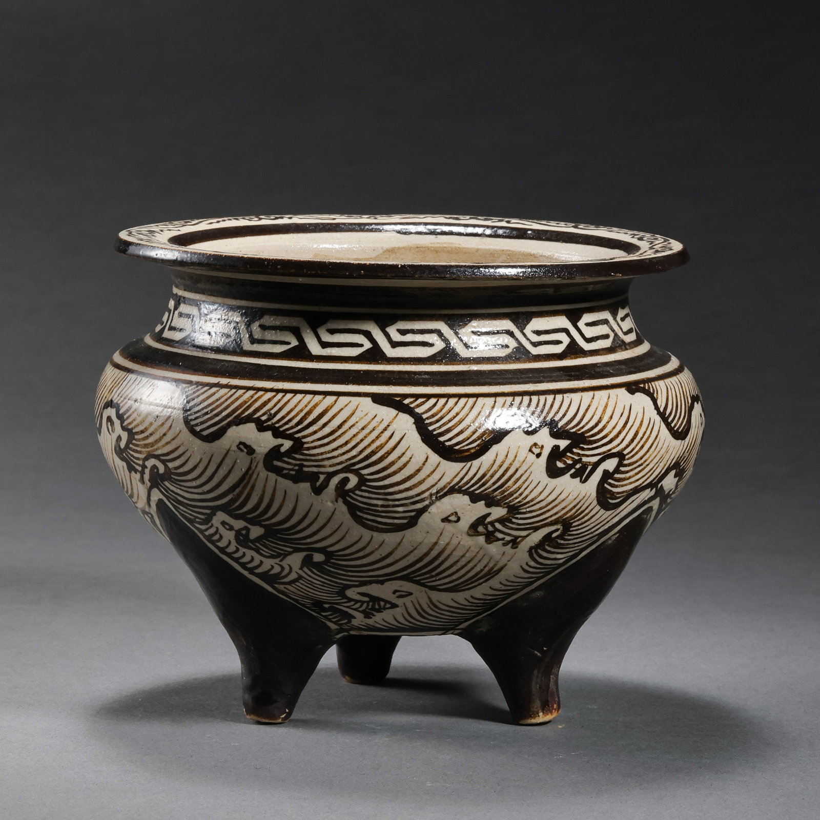 A three-legged censer with water ripple pattern from the Jizhou kiln during the Southern Song: H. 9.5 cm. Diam. 10.5 cm.