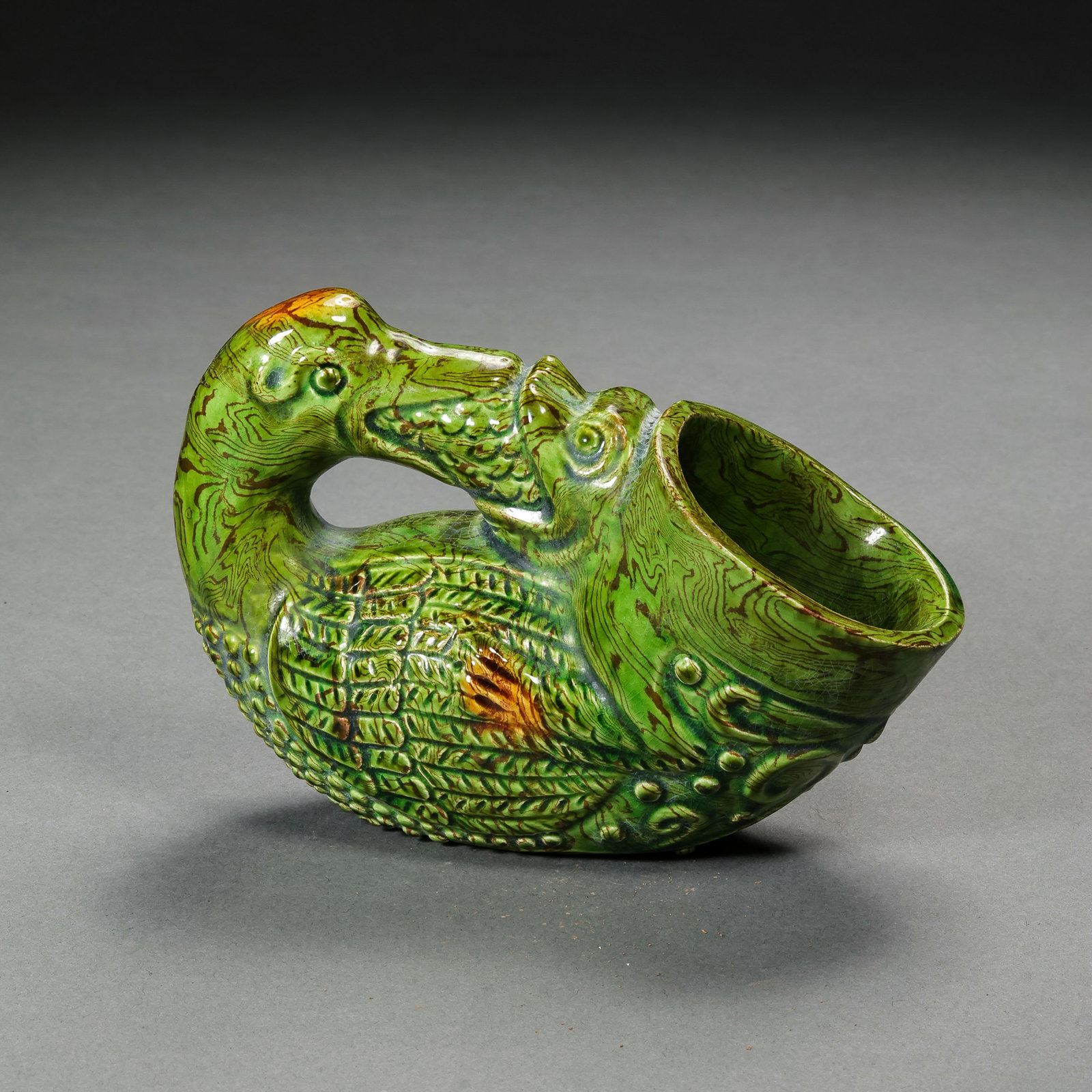 Chinese Tang Dynasty Green Glazed Marbled Duck-Shaped Cup: H. 7.5 cm. W. 11.8 cm.