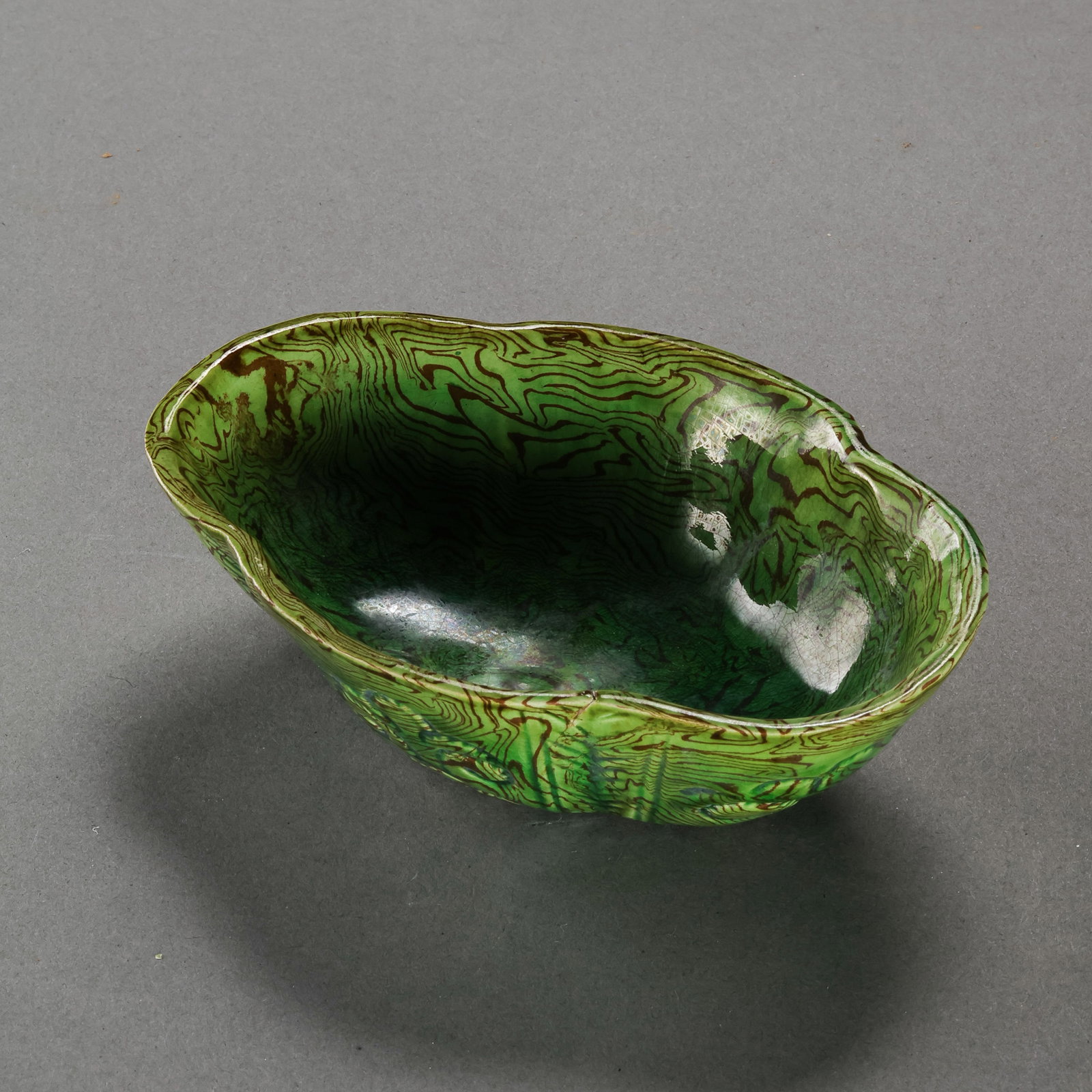 Chinese Tang Dynasty Green-Glazed Marbled Begonia-Shaped Wash Basin: H. 3.3 cm. L. 11 cm.