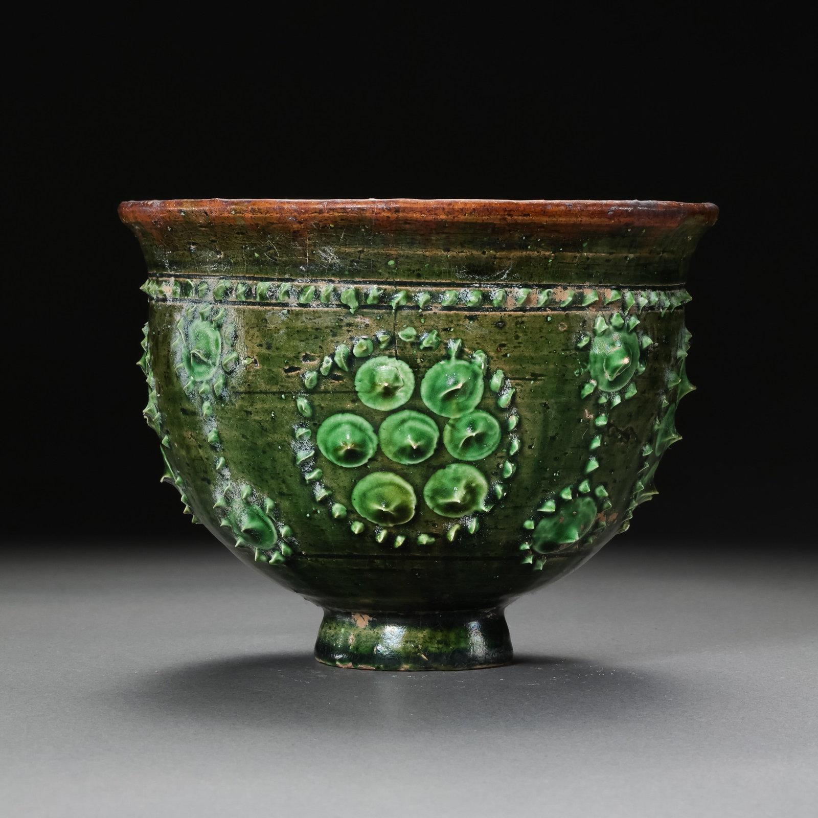 Chinese Sui Dynasty Green Glazed Drum Nail Pattern Cup: H. 9 cm. Diam. 11 cm.