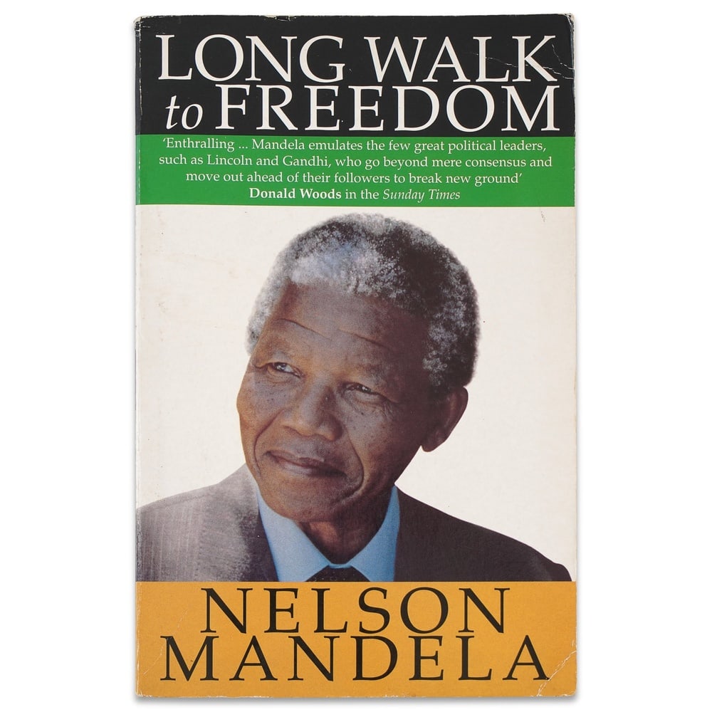 NELSON MANDELA SIGNED "LONG WALK TO FREEDOM": 7 3/4 x 4 7/8 in (19.7 x 12.5 cm) Provenance and Authentication: According to the accompanying documentation provided by the consignor, the signatures have been examined with reference to multiple