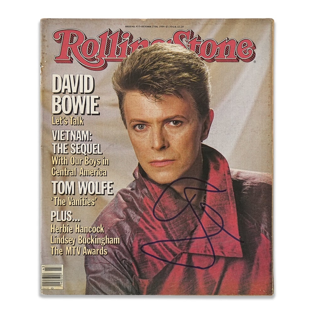 DAVID BOWIE SIGNED ROLLING STONE MAGAZINE (OCTOBER 25, 1984): 12 5/8 x 10 1/2 in (31.9 x 26.8 cm) Provenance and Authentication: According to the accompanying documentation provided by the consignor, the signatures have been examined with reference to multiple