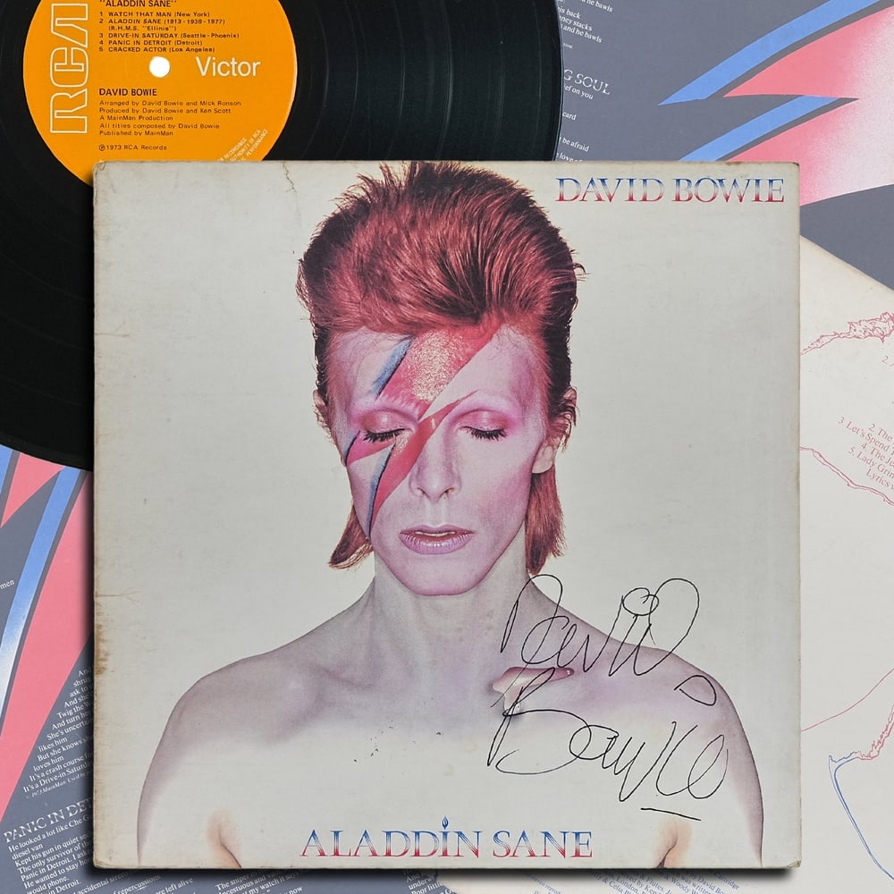 DAVID BOWIE SIGNED "ALADDIN SANE" UK FIRST PRESSING LP: 12 1/4 x 12 1/4 in Provenance and Authentication: According to the Letter of Authenticity (LOA) and Certificate of Authenticity (COA) provided by the consignor, this collectible was subjected to a