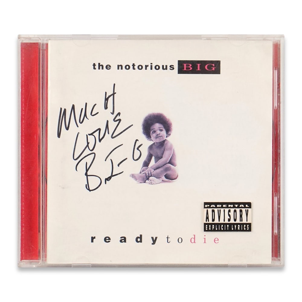 THE NOTORIOUS B.I.G. SIGNED "READY TO DIE" CD: 5 1/2 x 4 7/8 in (14 x 12.5 cm) Provenance and Authentication: According to the Letter of Authenticity (LOA) and Certificate of Authenticity (COA) provided by the consignor, this collectible was subje